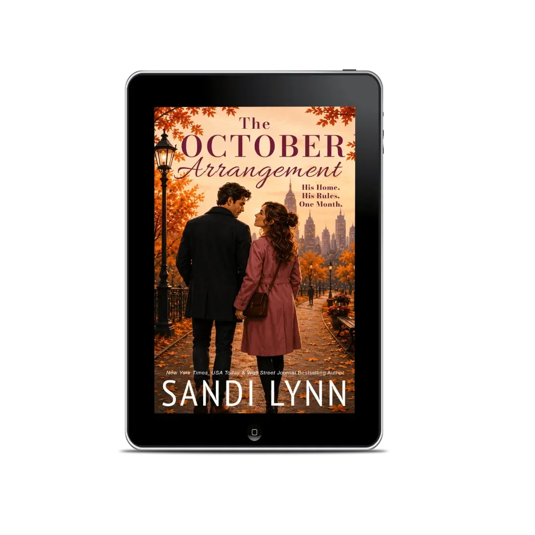 E-book cover of "The October Arrangement" by Sandi Lynn, showing a man and woman walking in Central Park with New York City skyline in the background during fall.