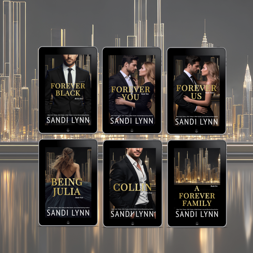 Six e-book covers by Sandi Lynn displayed on tablets in front of a cityscape at night. The covers feature couples and titles like 'Forever Black,' 'Forever You,' 'Forever Us,' 'Being Julia,' 'Collin,' and 'A Forever Family.'