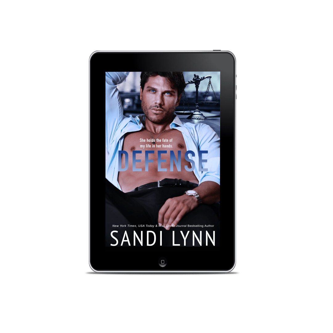 Cover of a book titled "Defense" by Sandi Lynn, featuring a man with blue eyes, partially shirtless, leaning back with a confident expression, with a background of a courtroom scene and a scale of justice.