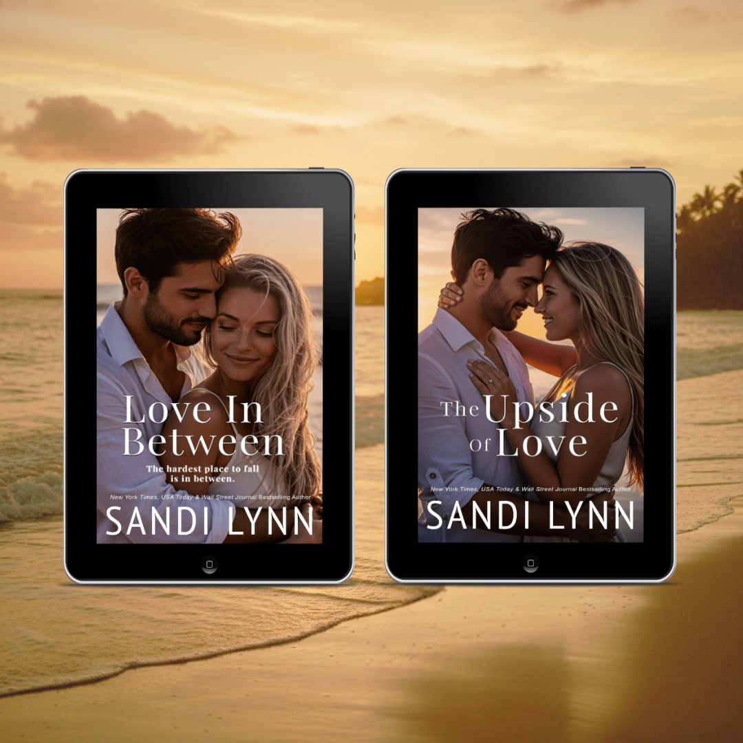 Two e-readers displaying romantic book covers featuring couples at the beach during sunset, with the titles "Love In Between" and "The Upside of Love" by Sandi Lynn, set against a beach background.