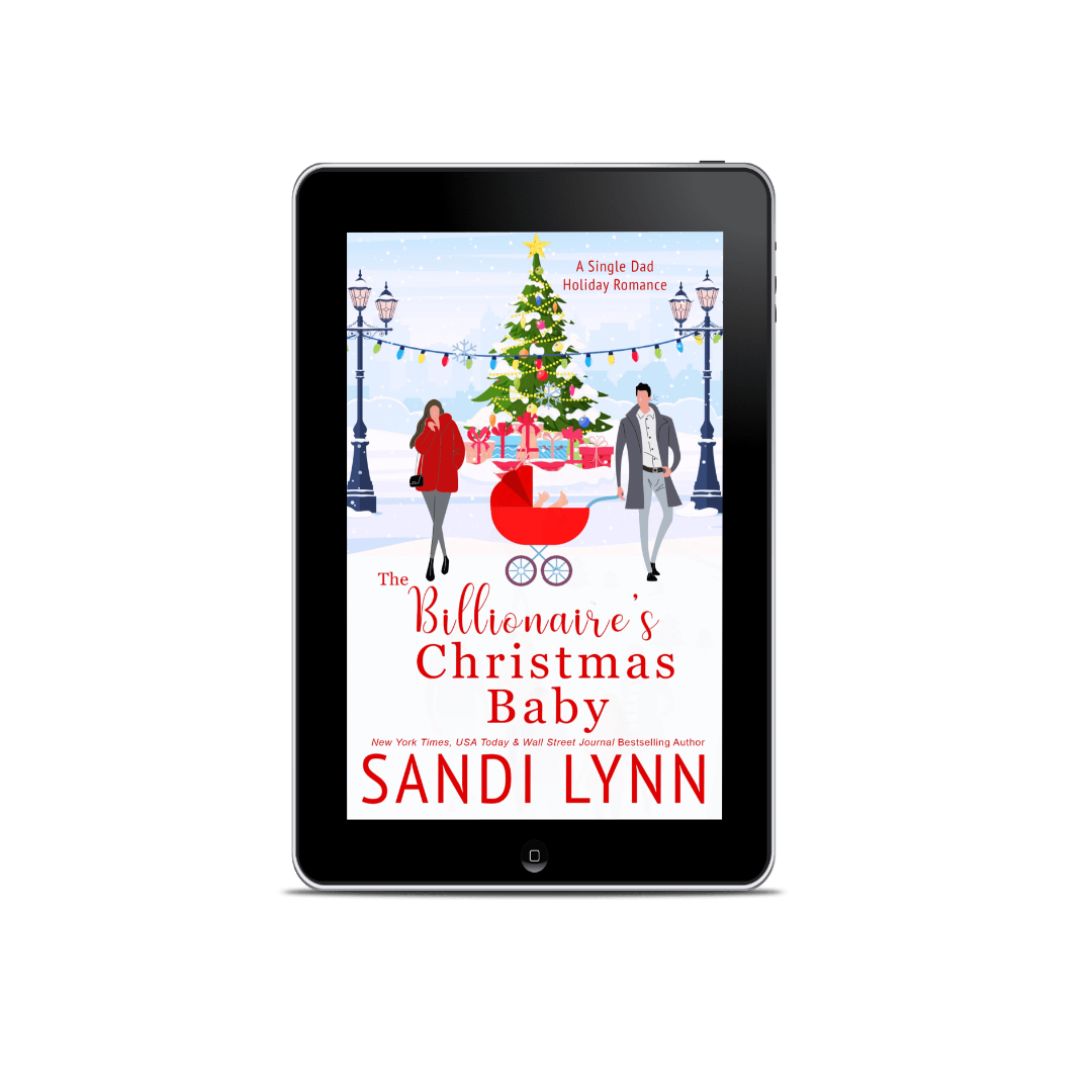 Cover of a book titled 'The Billionaire's Christmas Baby' by Sandi Lynn, displayed on an e-reader. The cover features a snowy scene with a decorated Christmas tree, a baby stroller, a man and woman walking, and gifts in the background.