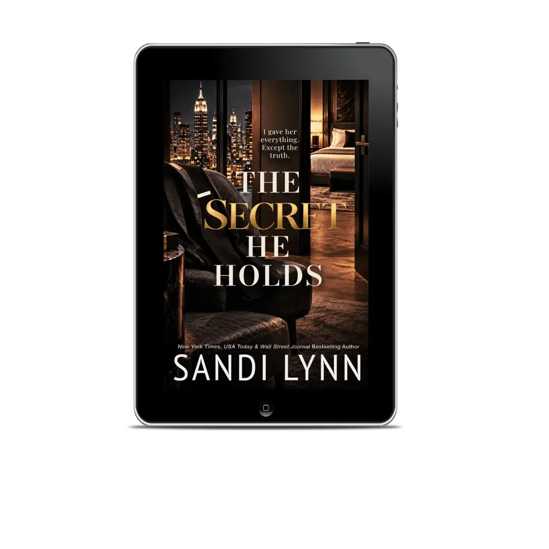 E-book cover titled "The Secret He Holds" by Sandi Lynn, featuring a nighttime cityscape and a luxurious hotel room interior in the background.