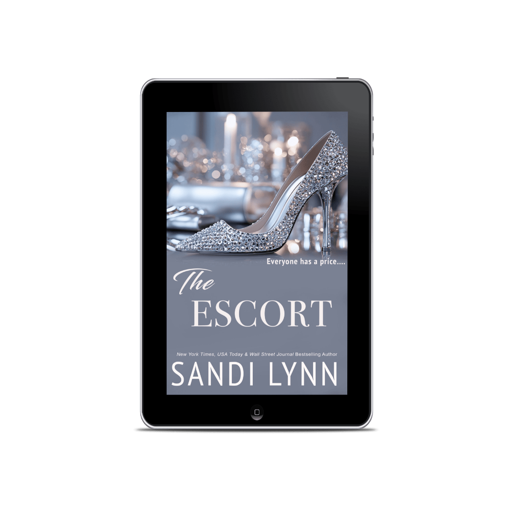 Cover of the book titled "The Escort" by Sandi Lynn, featuring a high-heeled shoe decorated with sparkling rhinestones on the screen of a tablet, with a blurred background.