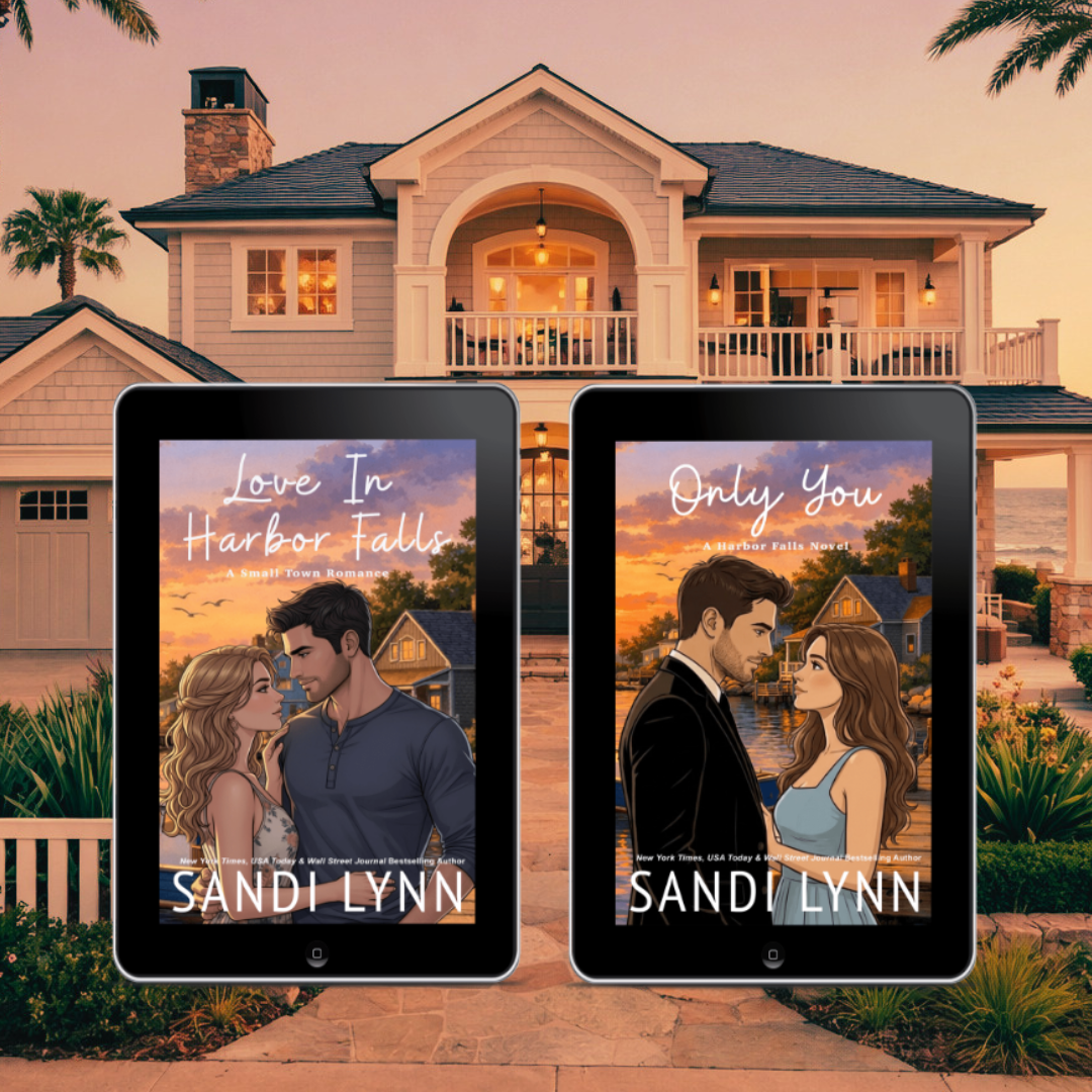 Two e-book covers in front of a large, two-story house at sunset. The covers feature romantic illustrations of a man and woman, with titles "Love In Harbor Falls" and "Only You" by Sandy Lynn.