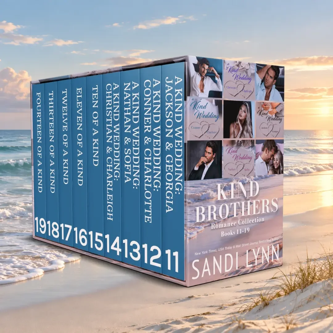 A boxed set of romance novels titled 'Kind Brothers' by Sandi Lynn, placed on a sandy beach with waves and a sunset in the background. The set includes 19 books with titles like 'A Kind Wedding,' 'Twelve of a Kind,' and 'Fourteen of a Kind.' The box features images of couples and the author's name.