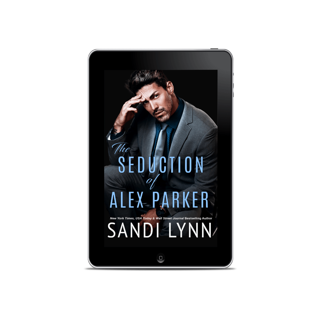E-book cover for 'The Seduction of Alex Parker' by Sandi Lynn, featuring a man in a gray suit with dark hair, sitting and holding his head with a serious expression against a black background.
