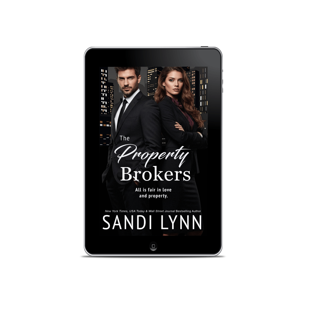 Cover of a book titled 'The Property Brokers' by Sandi Lynn, featuring a man and woman in business attire standing with crossed arms against a cityscape background on a tablet screen.