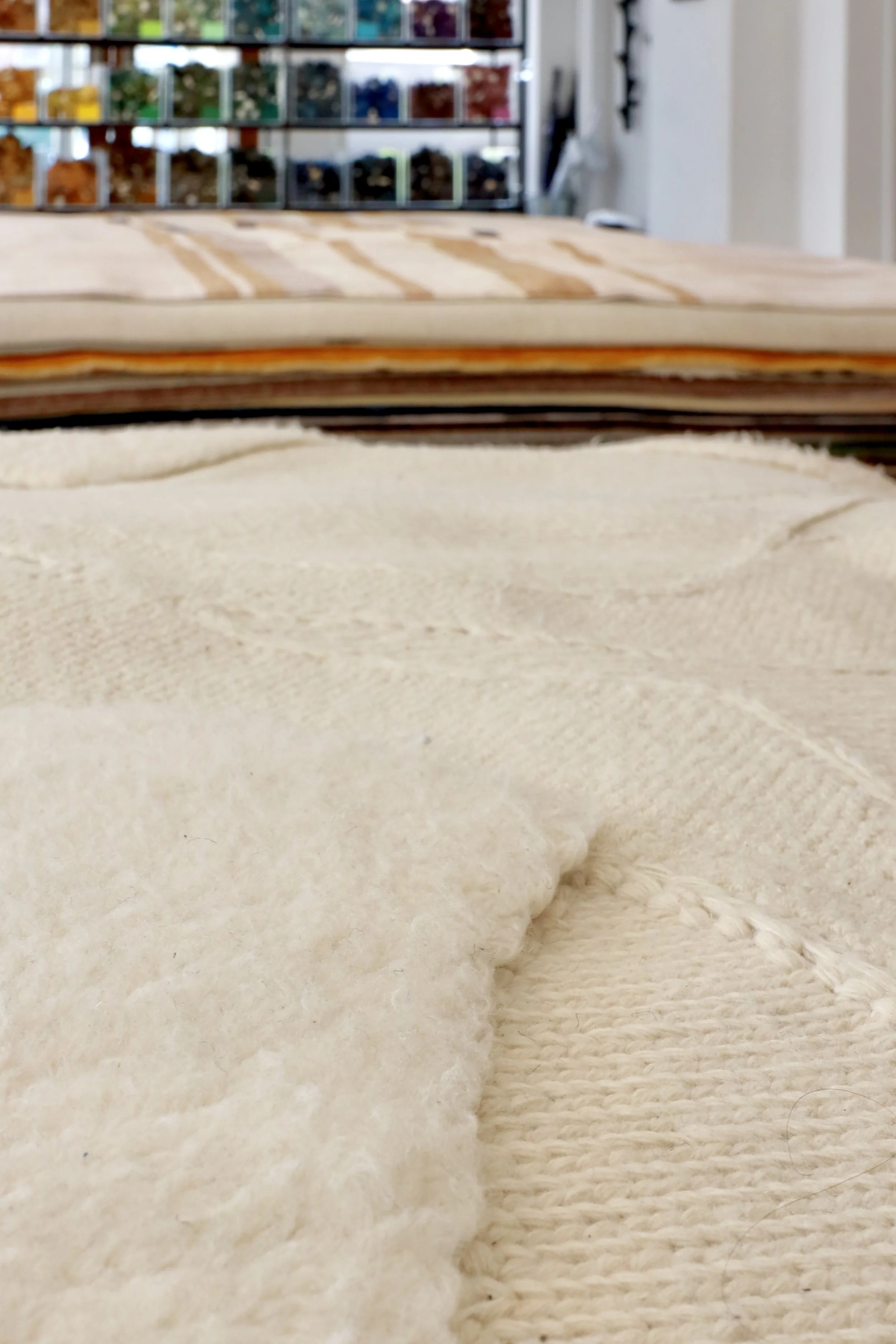 Close up Creative Mattes rug stack Origins Rug Collection Macrame