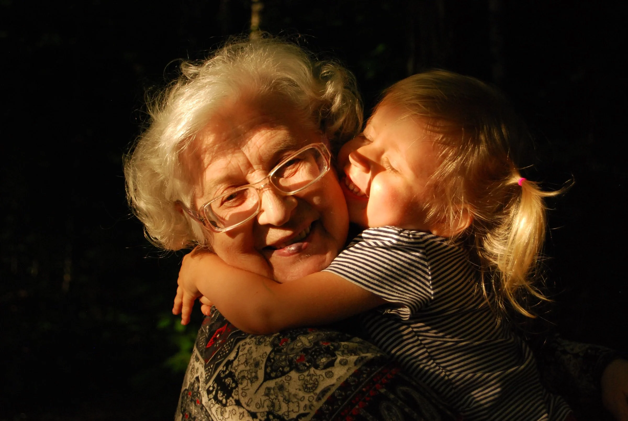 Warm embrace between loved ones representing treasured recent memories