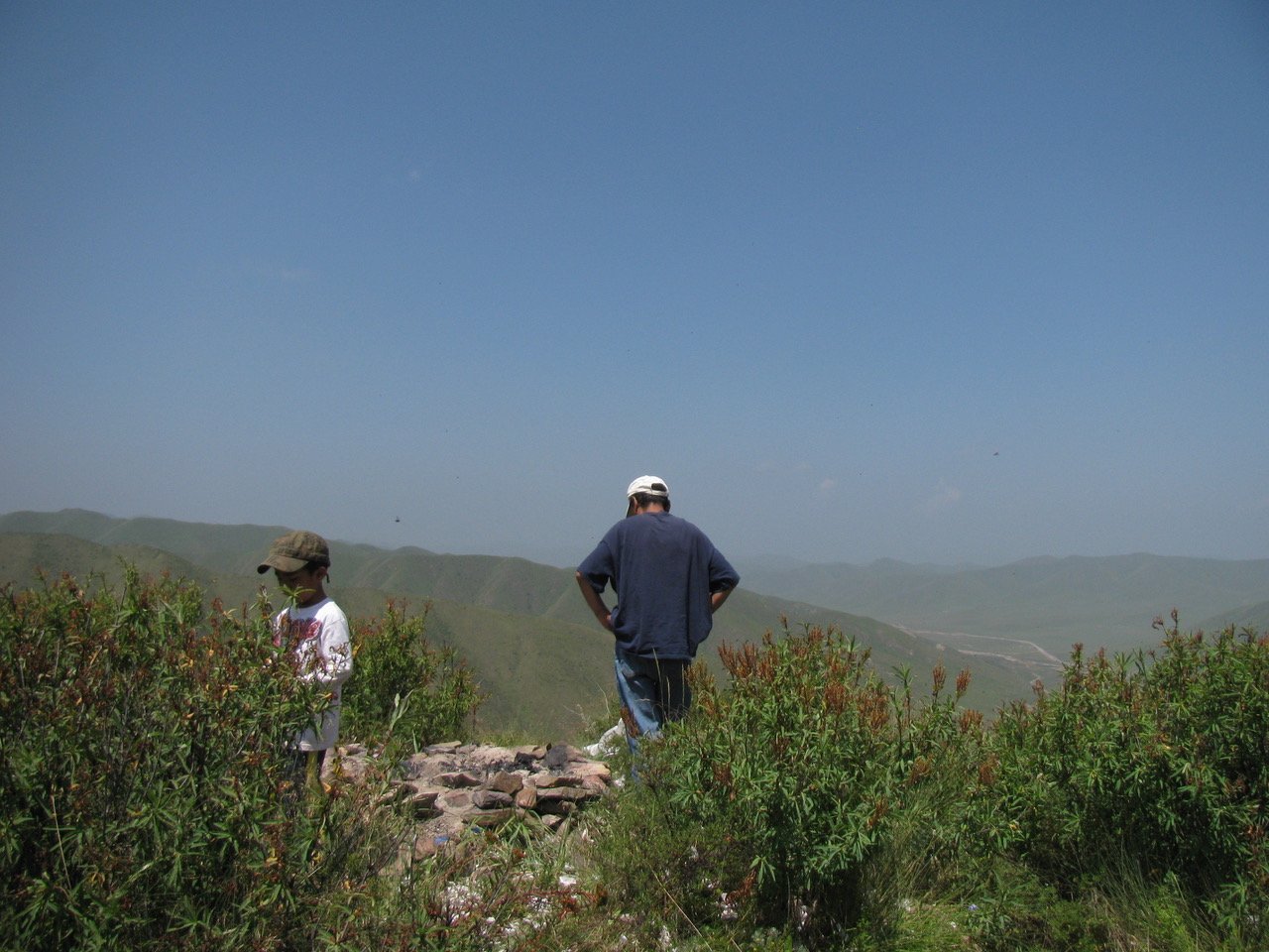  My brother Dorji and my father, atop the mountain from the last photo. This visit was an attempt for my father to see his parents before they pass. A great irony. 