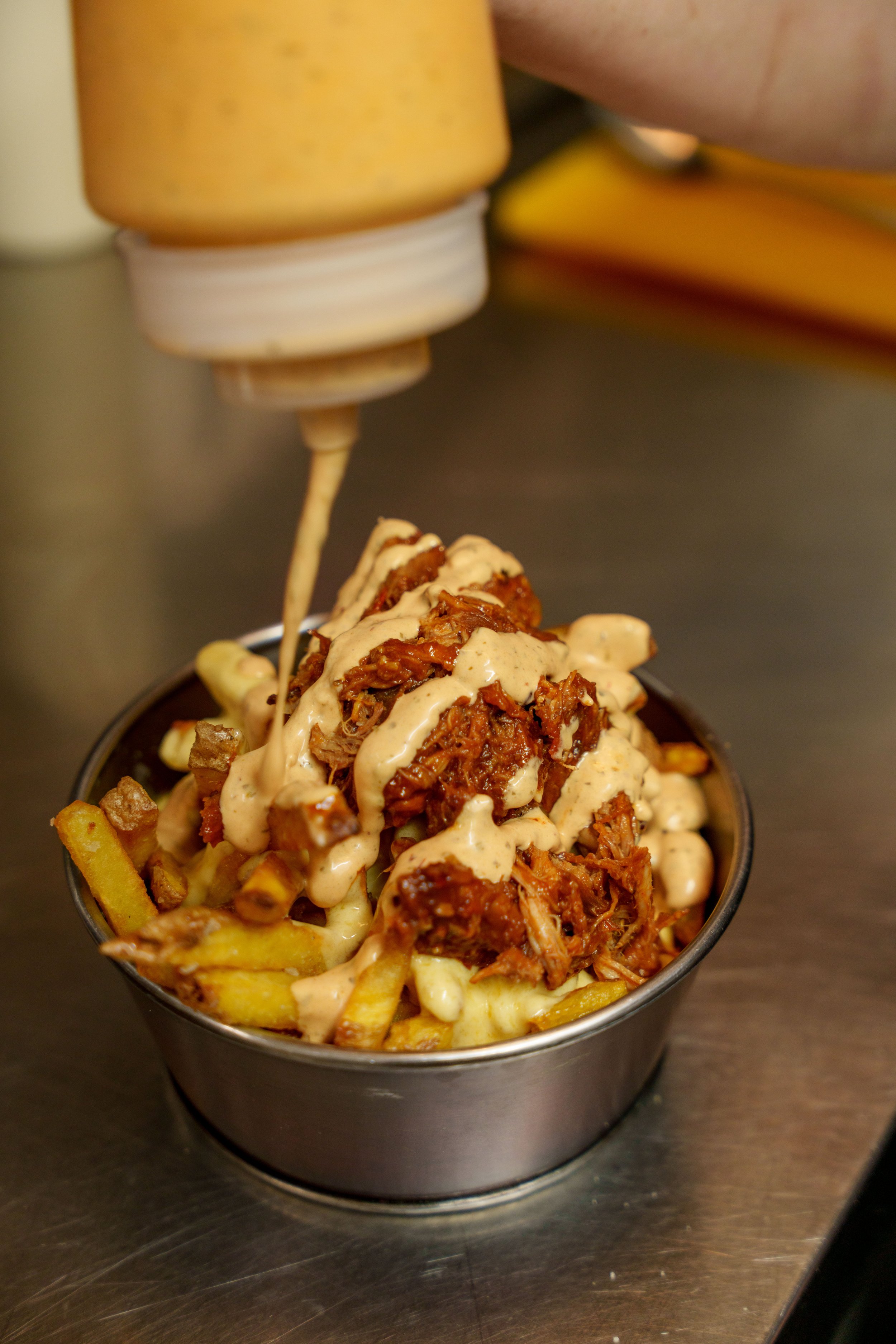 Loaded fries with sauce close up.jpg