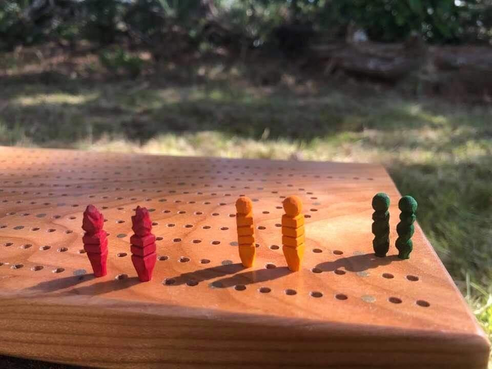 Father-Daughter Collaboration- Three Player Cribbage Board: Cherry with Brass inlay (father), Whittled and Dyed Maple Pegs (daughter).