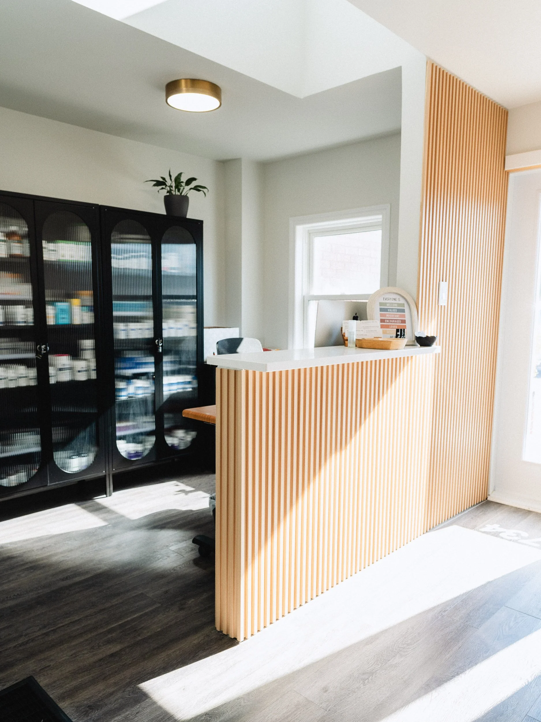Modern and welcoming reception area at Natural Route Health naturopathic clinic in Kingston.
