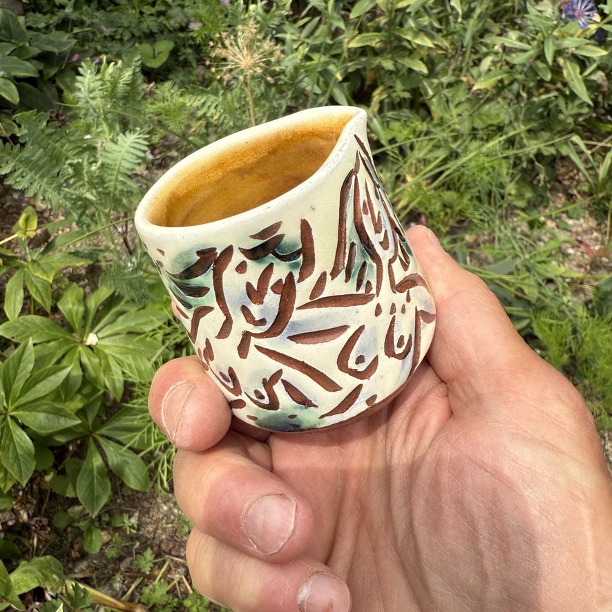 pot2944 - Cream jug withcuddling galpals. Caramel glaze inside.