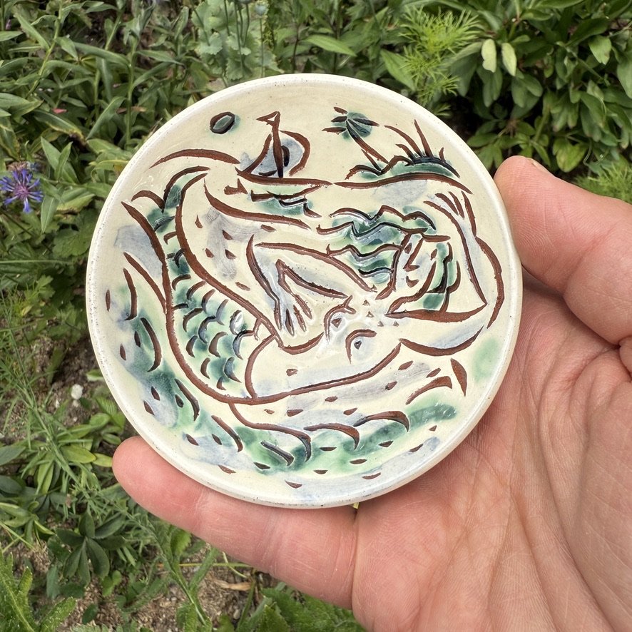 pot2953 Salt dish with mermaid with green tail. Mermaid and swimmer on reverse.