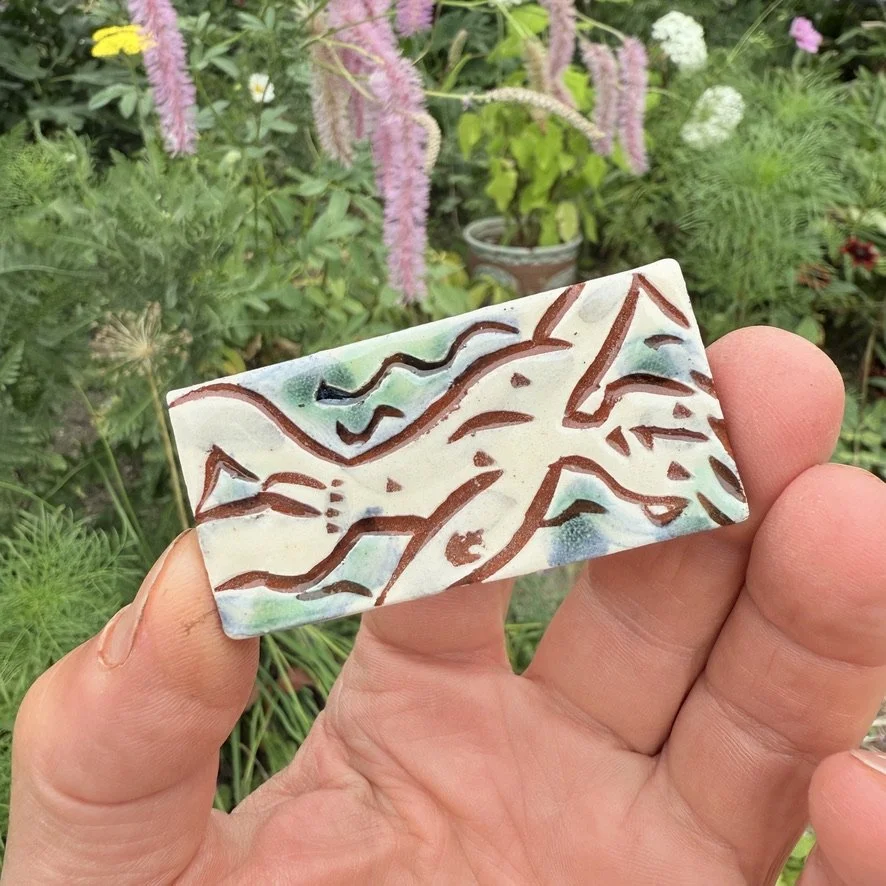 pot3010 Small rectangular tile with naked fellow.