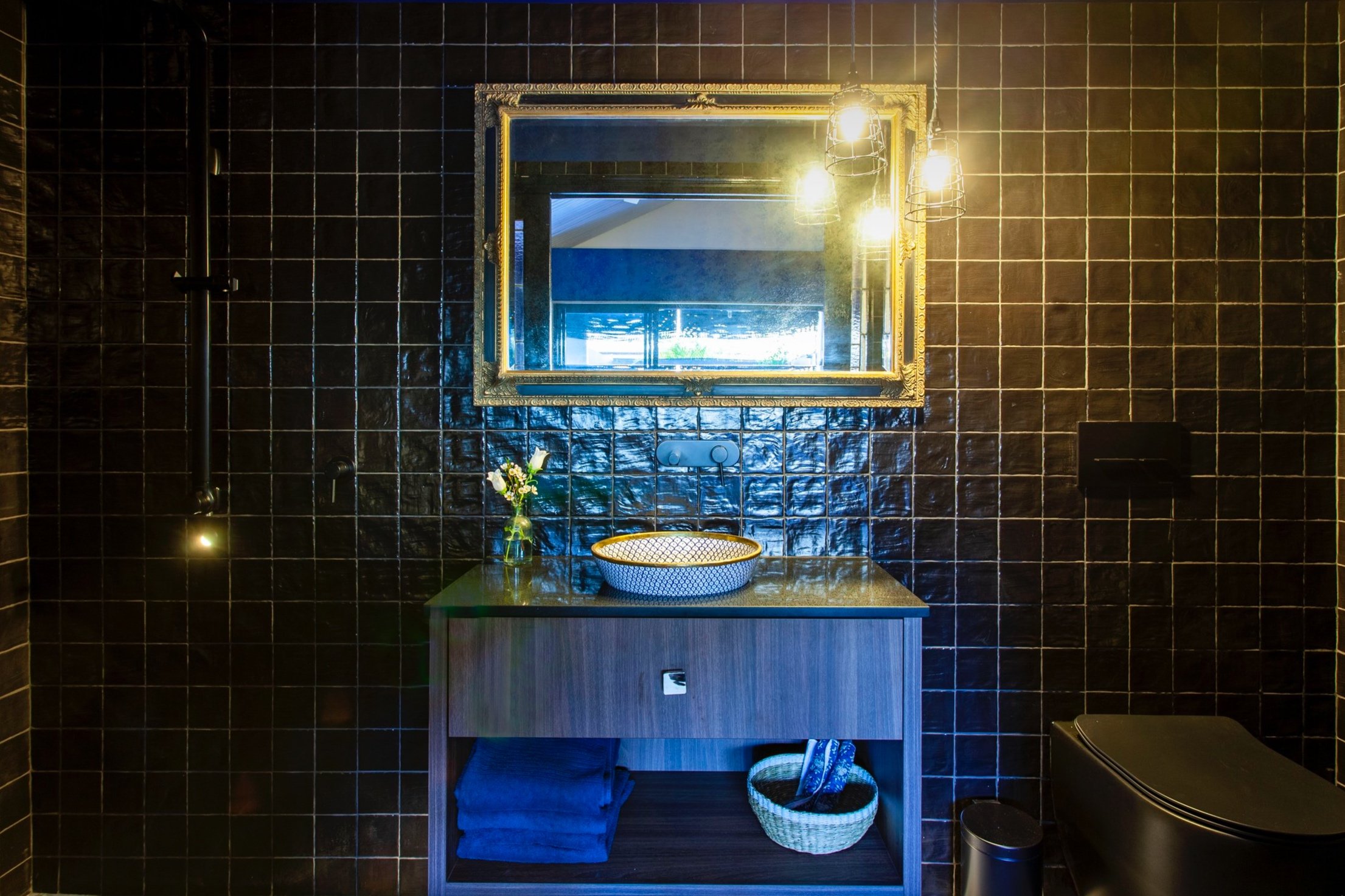 Salon ensuite with gold mirror.