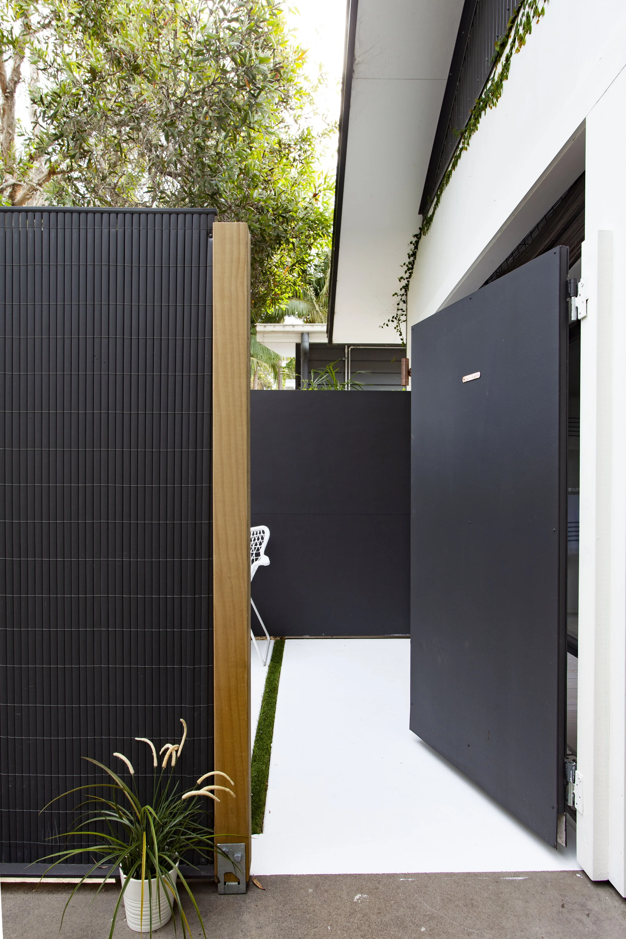 Peeking through the slightly ajar entrance gate, one can catch a glimpse of the enchanting courtyard beyond. The Parisian-inspired studio awaits inside, promising a dreamy escape with its stylish decor and thoughtful amenities