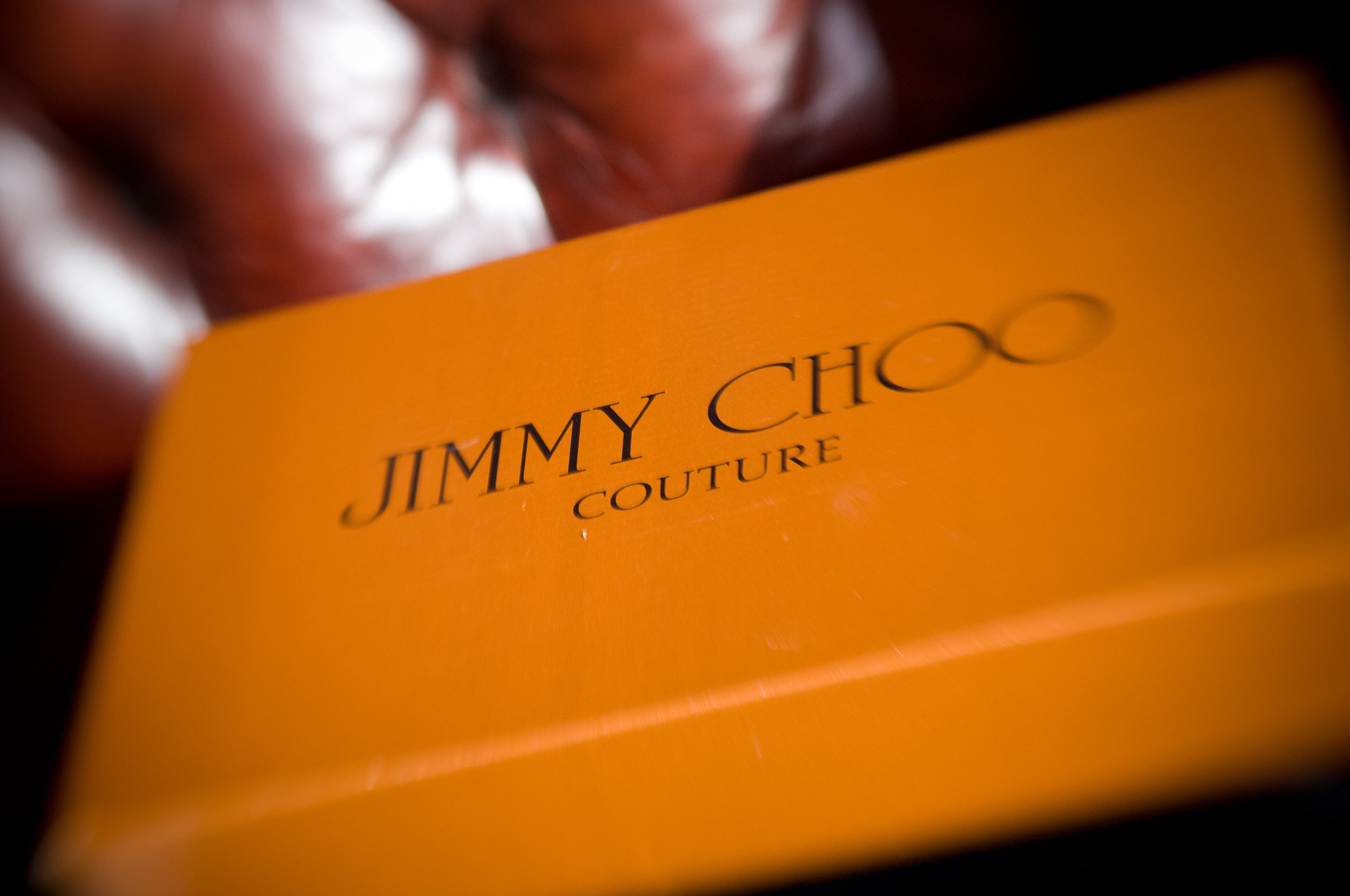 Orange box with "Jimmy Choo Couture" text