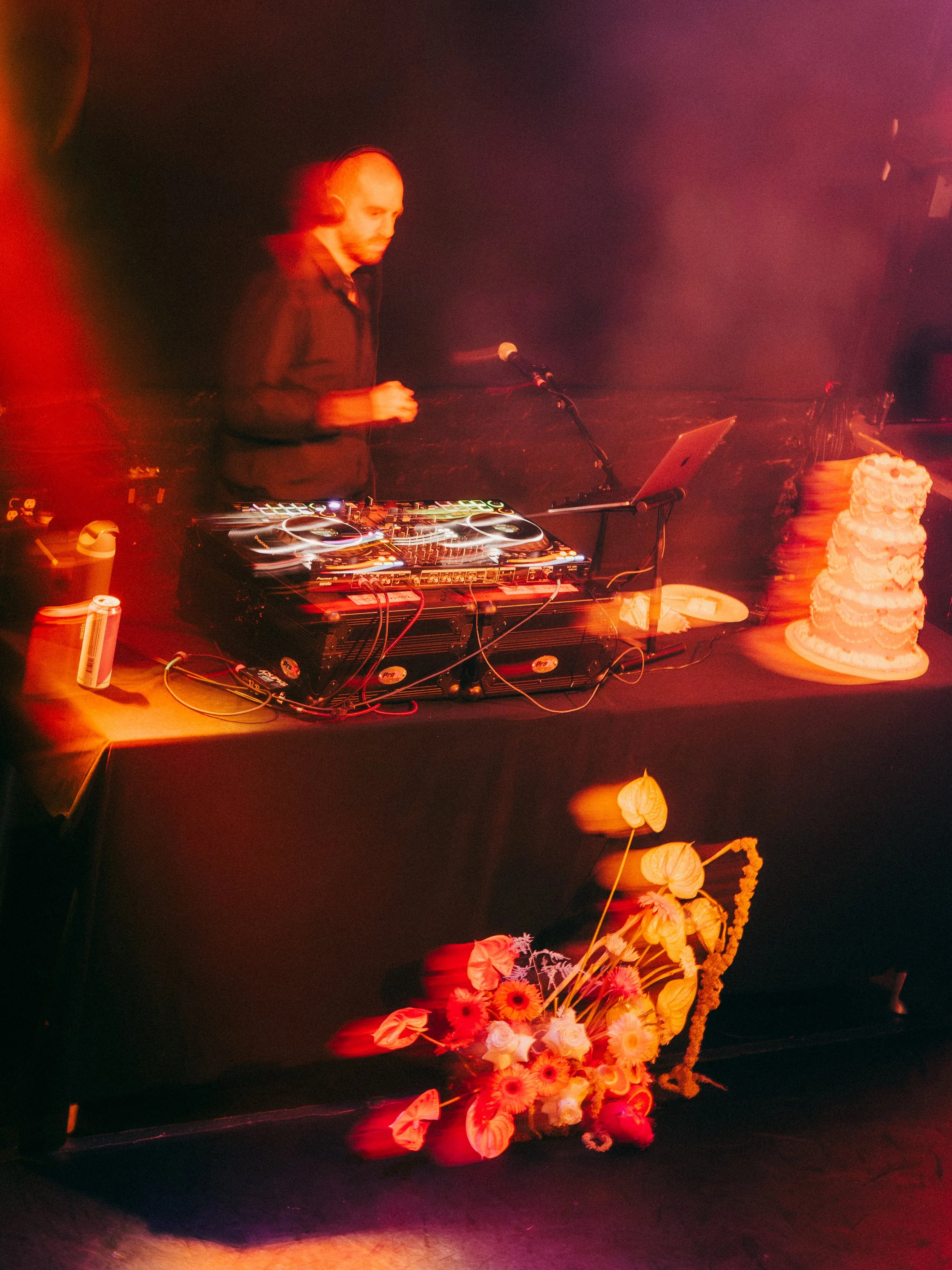 Rager wedding with technicolor wedding flowers adorned with citrus on the Lower East Side at the Bowery Ballroom. Photo by Inez Valencia.