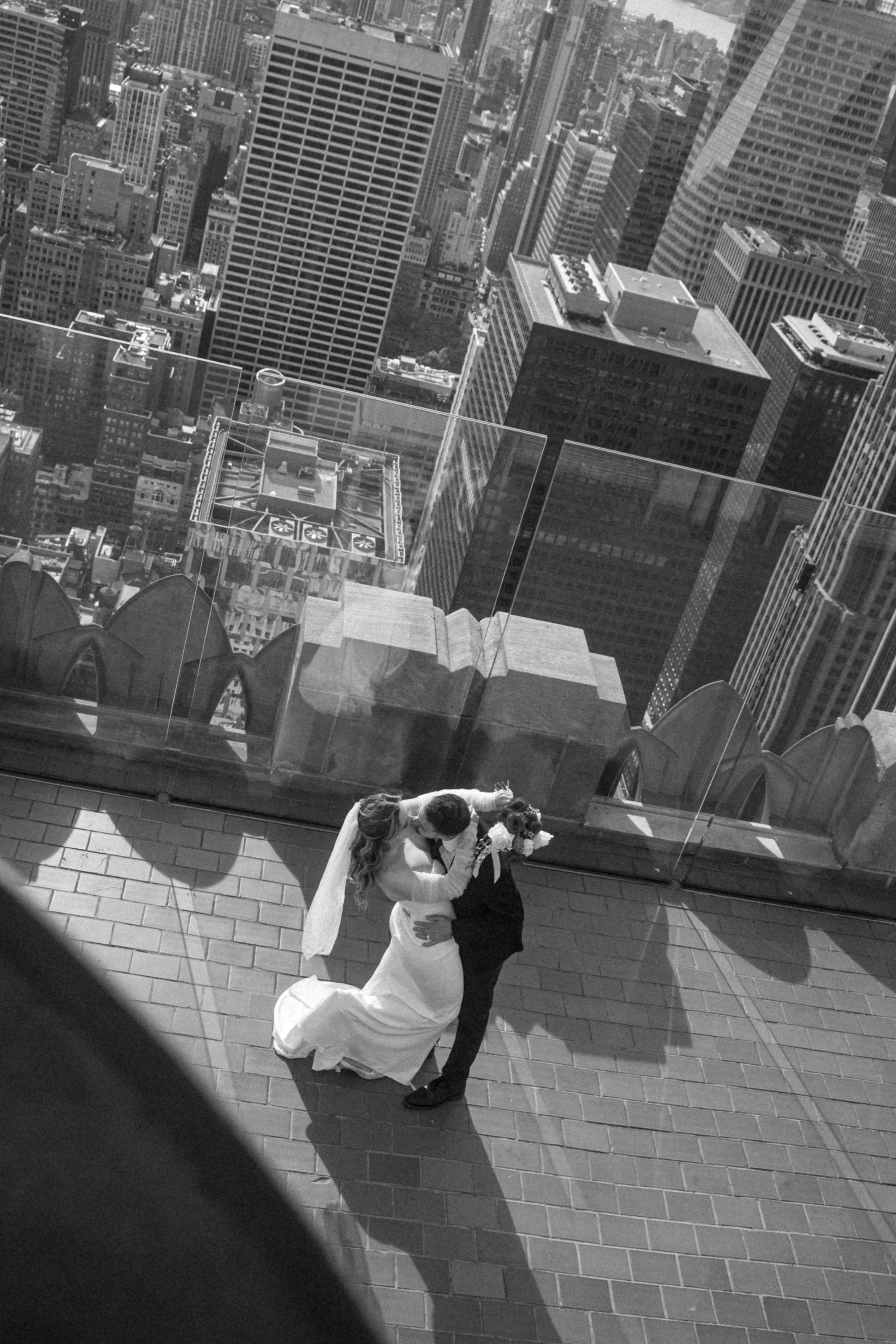 Nothing beats the view of the NYC skyline, and a couple saying I promise you forever. Photo by Brittany Dobrowski, makeup by Lemony NYC.