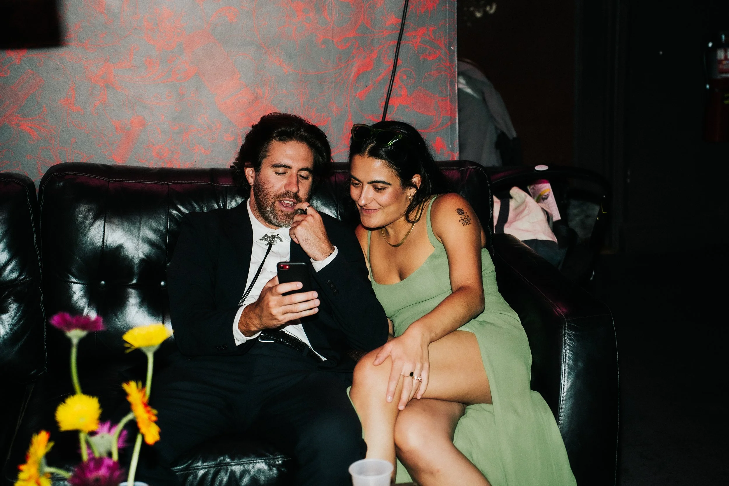 Rager wedding with technicolor wedding flowers adorned with citrus on the Lower East Side at the Bowery Ballroom. Photo by Inez Valencia.
