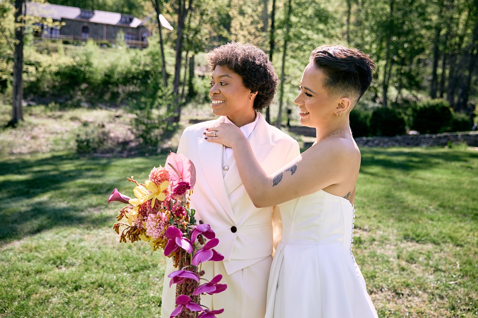 Two brides say their vows at an iconic tent wedding on a mountainside in the Catskills. Planned by Finally May and photographed by Love, Violeta Rose.