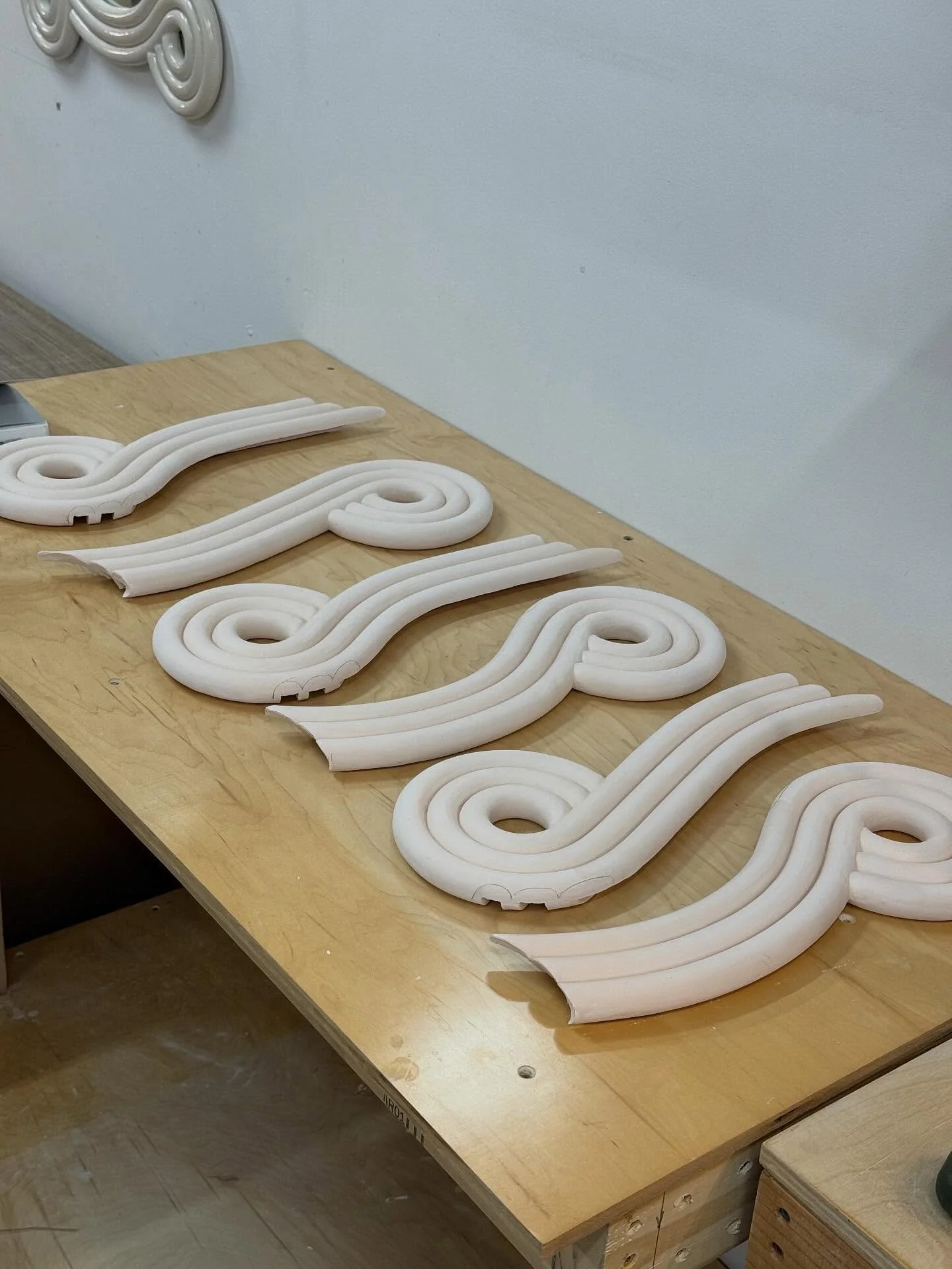 Process process process. Before glazing - all the mirror pieces are dry-fit and cleaned even further to make sure they fit together perfectly. 

I place them over the template and sand/grind them so there are few gaps and they are all on the same pla