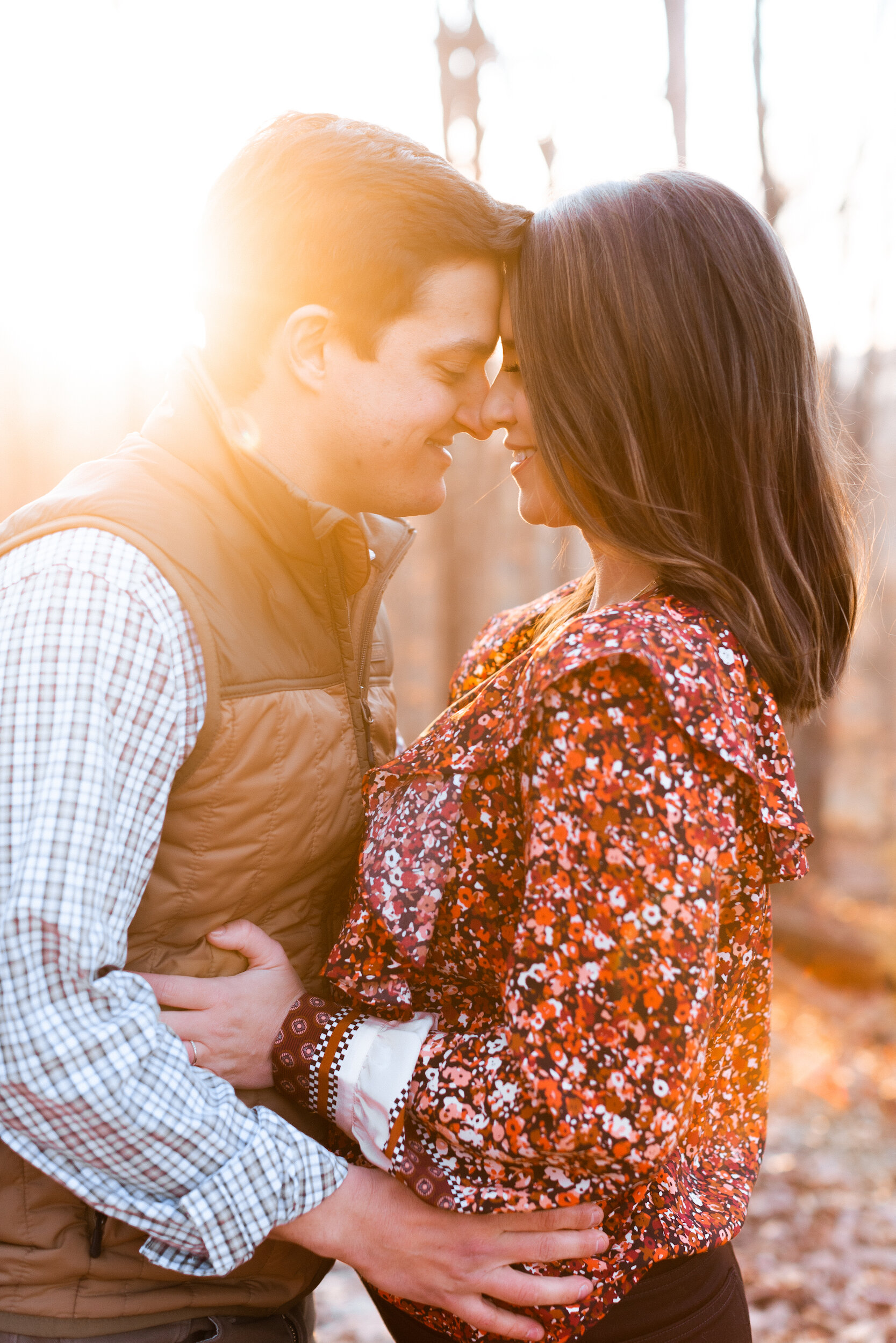 Couple Cuddling at Sunset During Family Farm Winter Engagement Photo Session