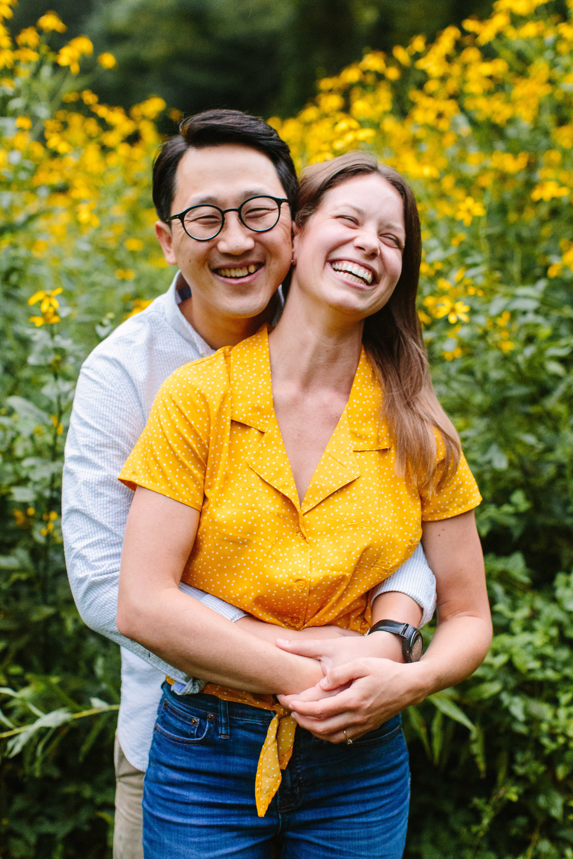Couple laughing in Rain | Max Patch Wildflower Rainy Engagement Photos