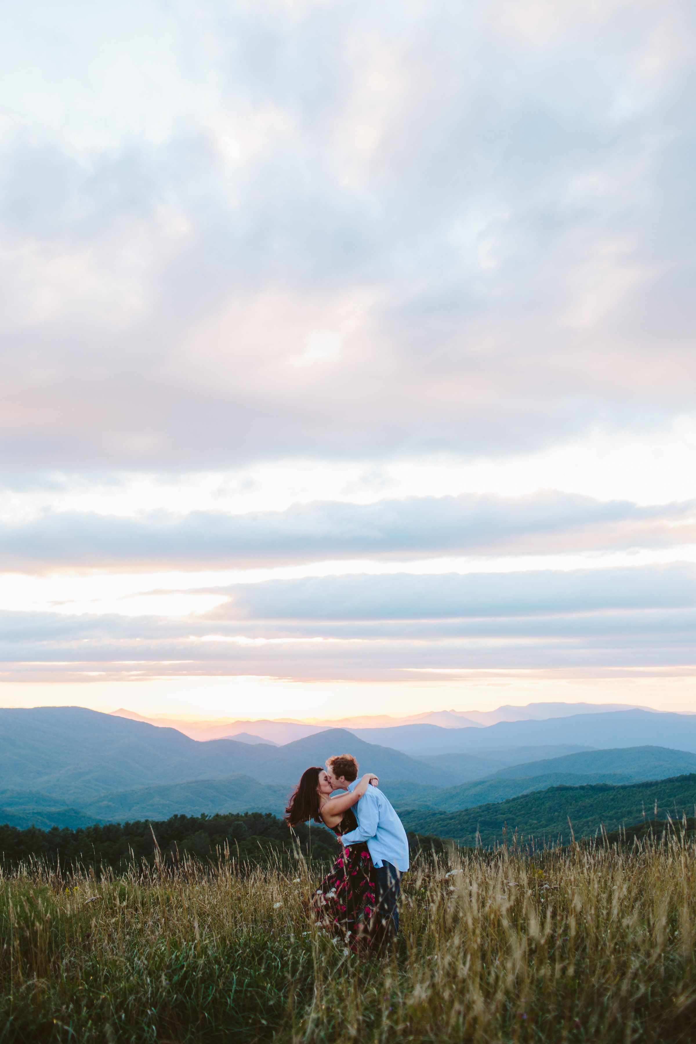 Max Patch Summer Engagement Photos on the Mountain at Sunset couple kissing