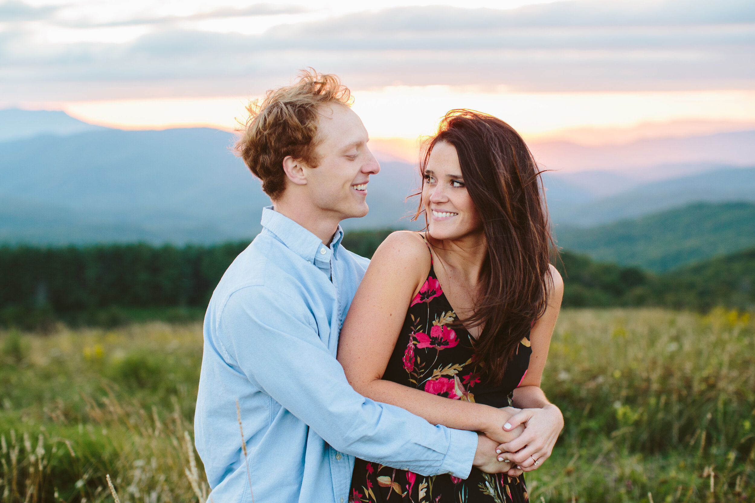 Max Patch Summer Engagement Photos on the Mountain at Sunset couple laughing