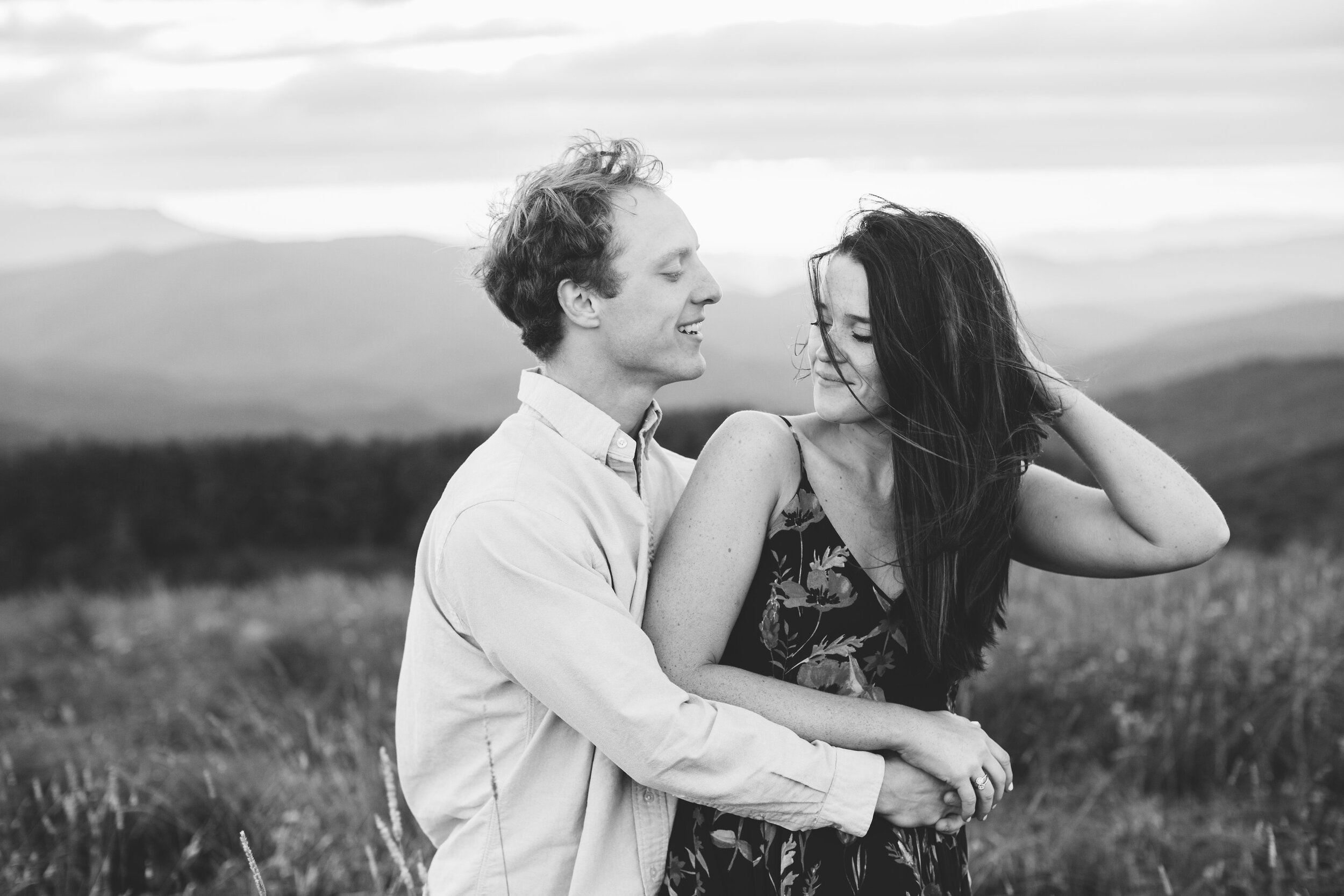 Max Patch Summer Engagement Photos on the Mountain at Sunset wind blowing hair