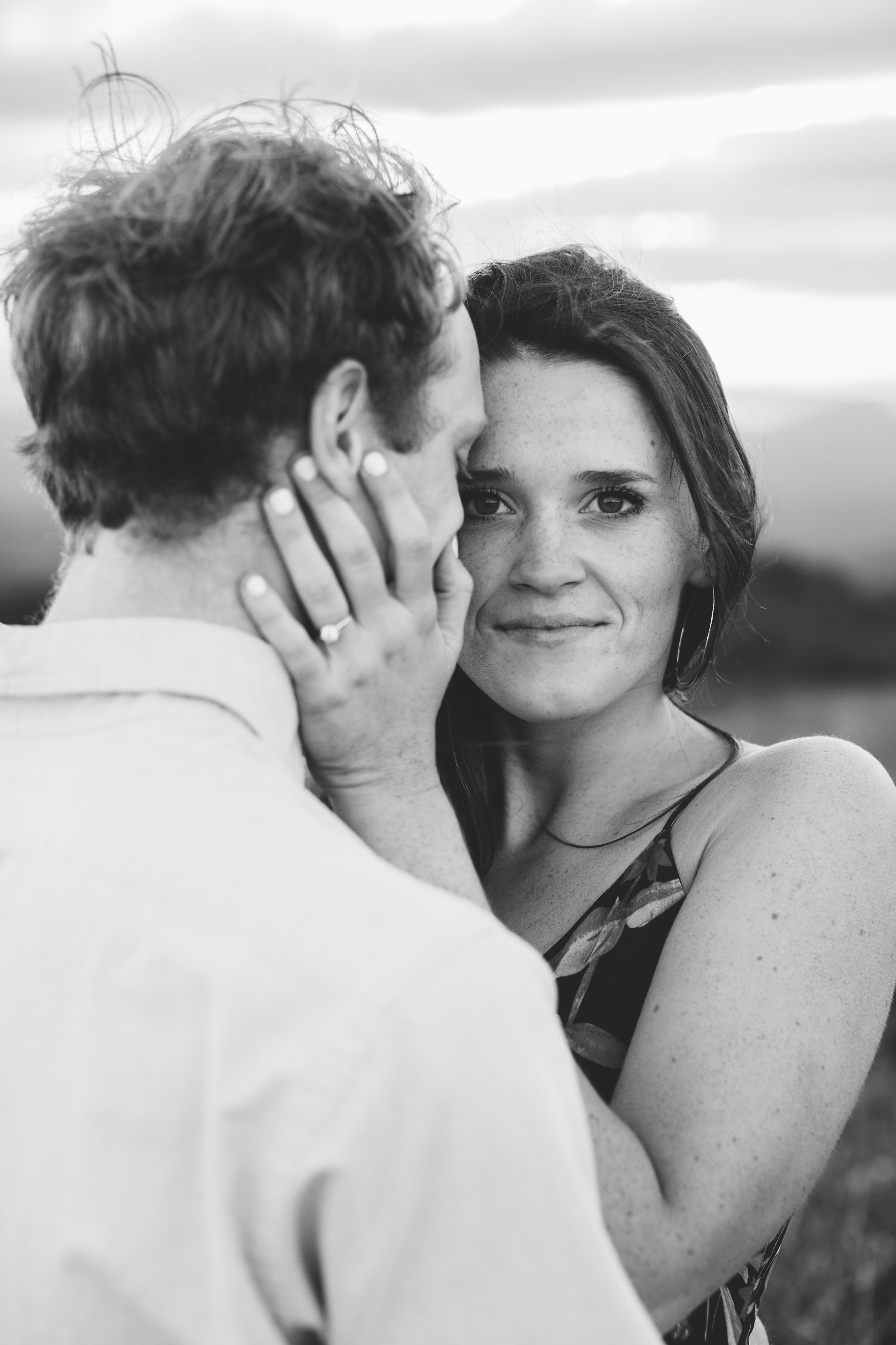 Max Patch Summer Engagement Photos on the Mountain at Sunset couple snuggling