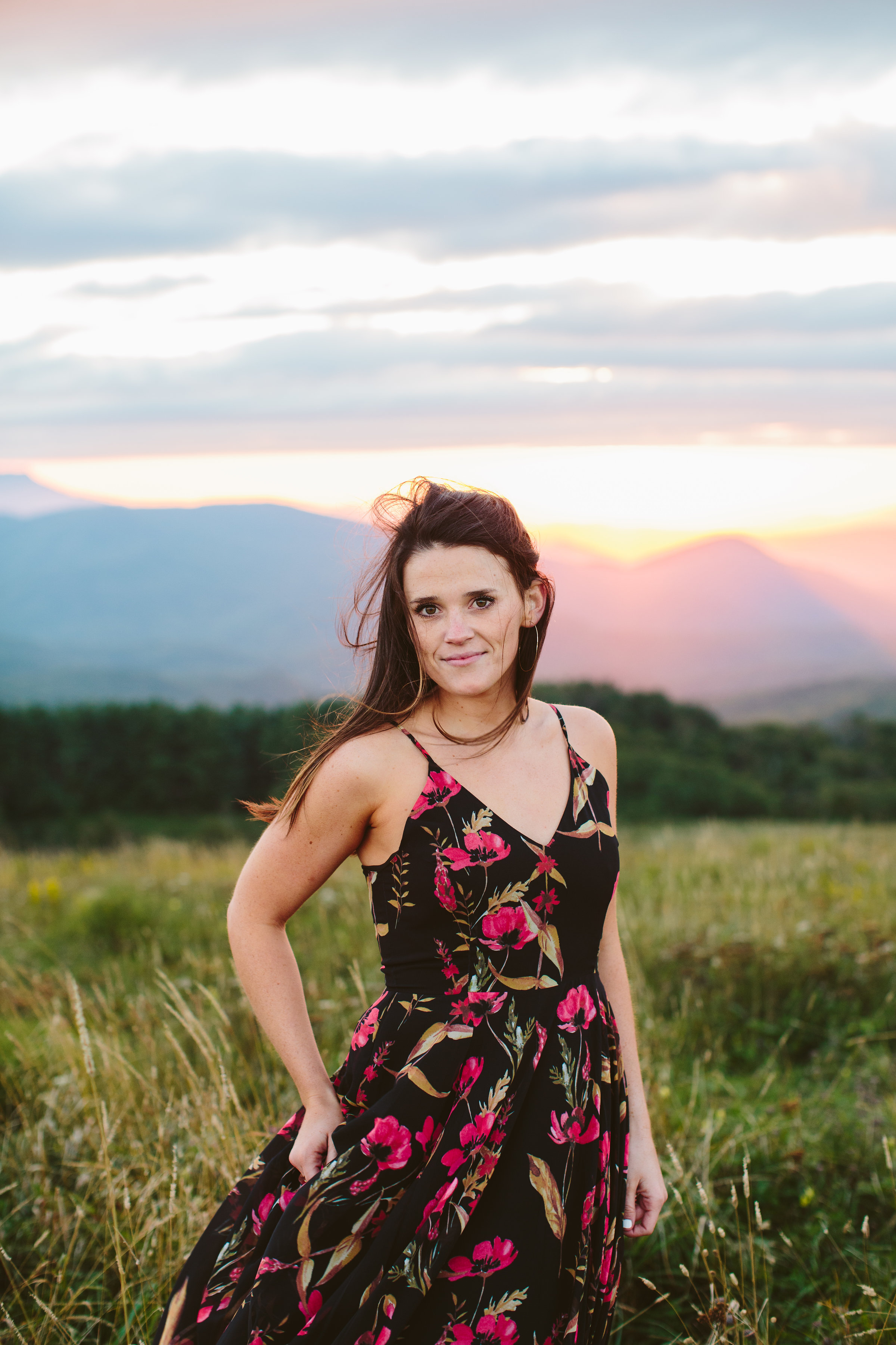Girl in windblown dress Max Patch Summer Engagement Photos on the Mountain at Sunset