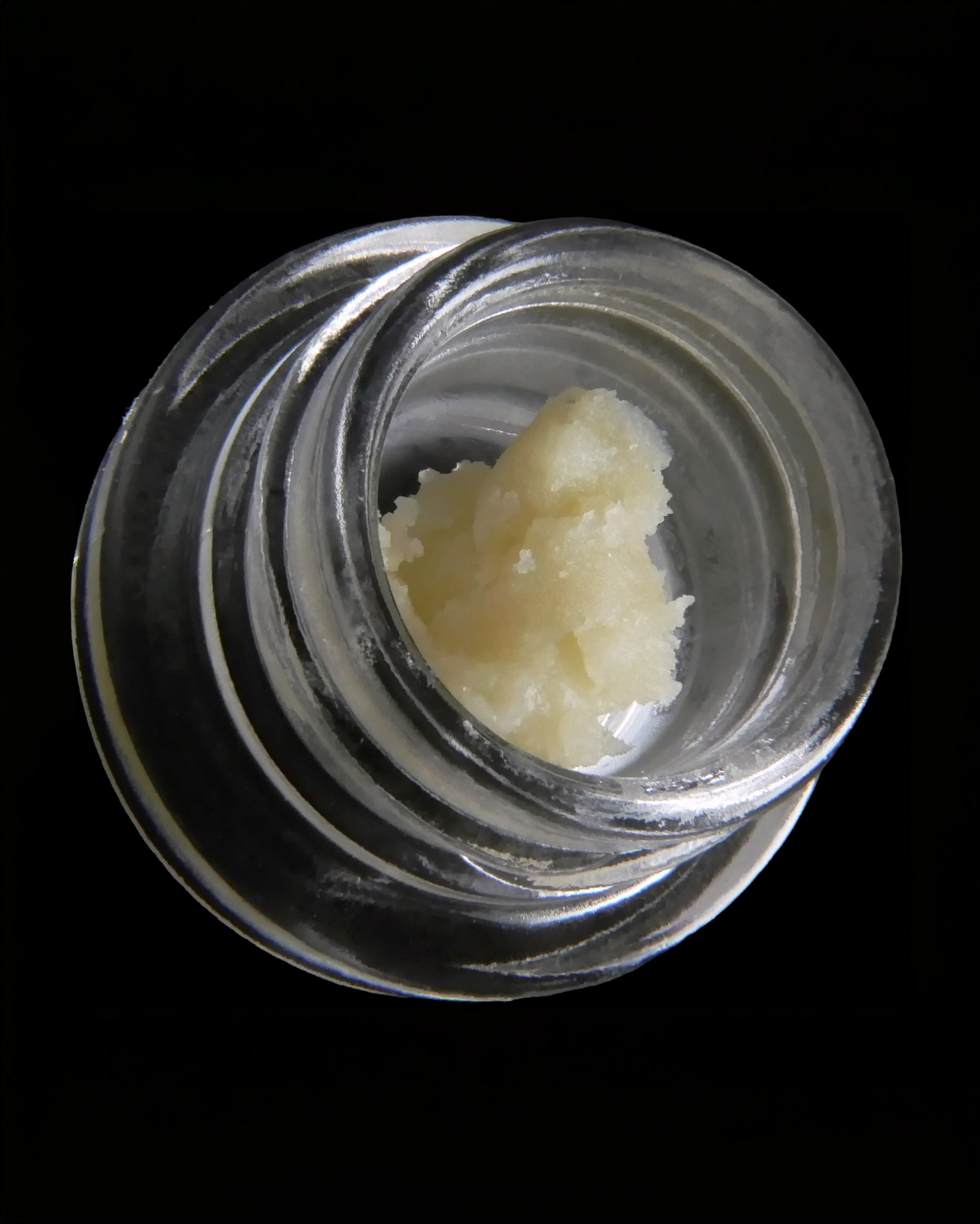 Papaya Juice Rosin in a jar on a black background