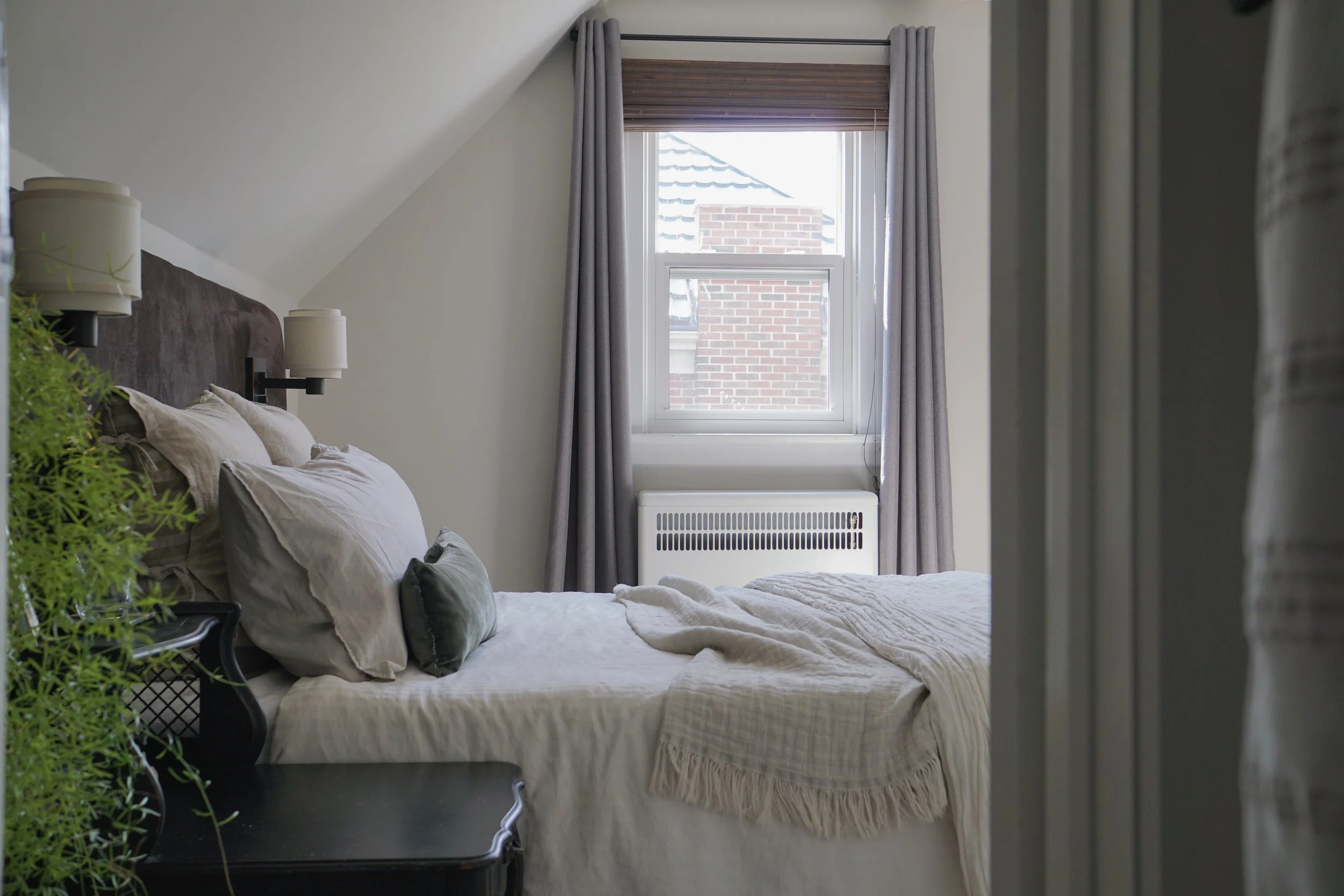Brown, cream, white, green bedroom palette. antique night stands, wide headboard wall sconces - Cheryl Lee Interiors