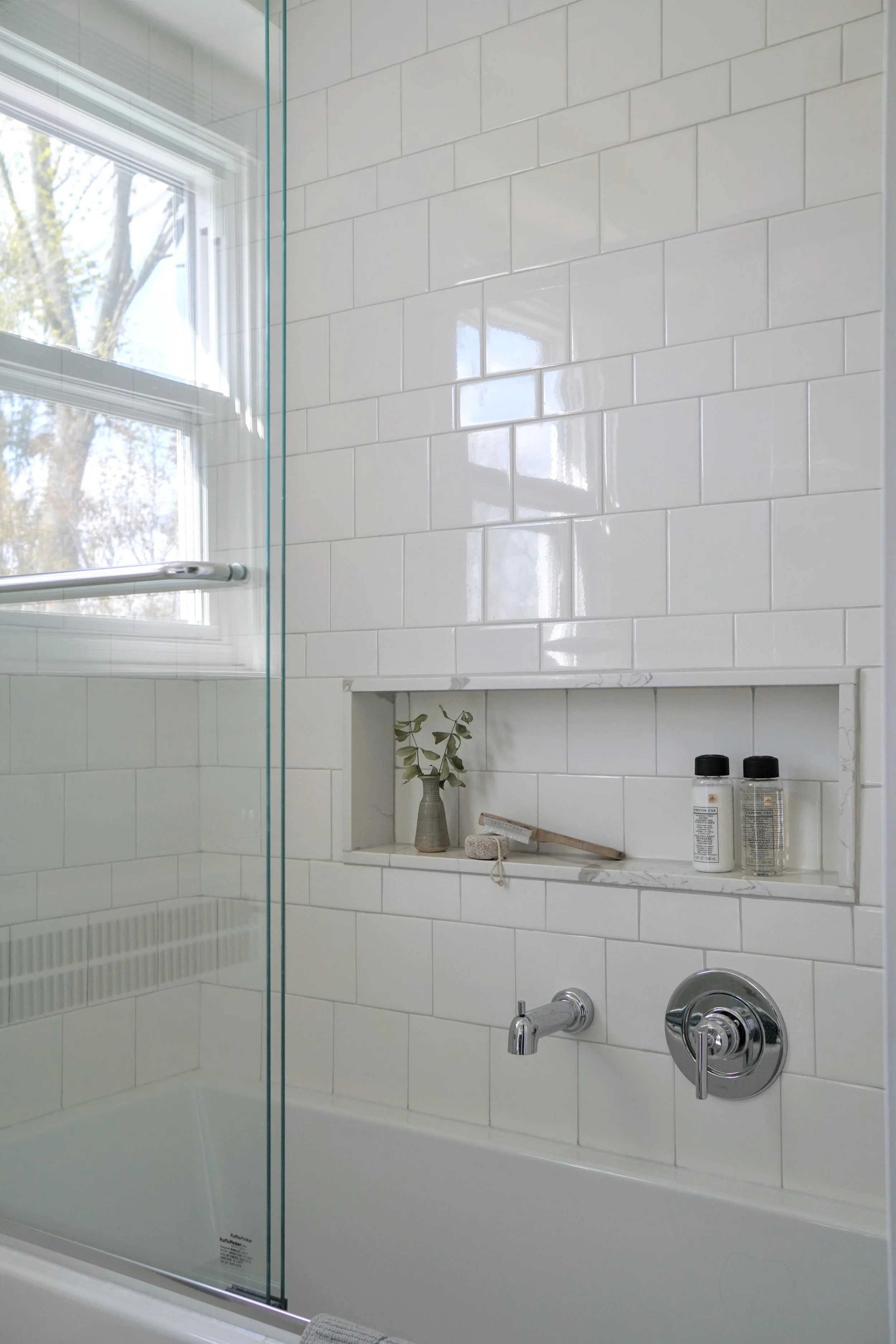 Shower bath combination alcove, warm white subway tile square and rectangle pattern, marble sill shower niche - Cheryl Lee Interiors 