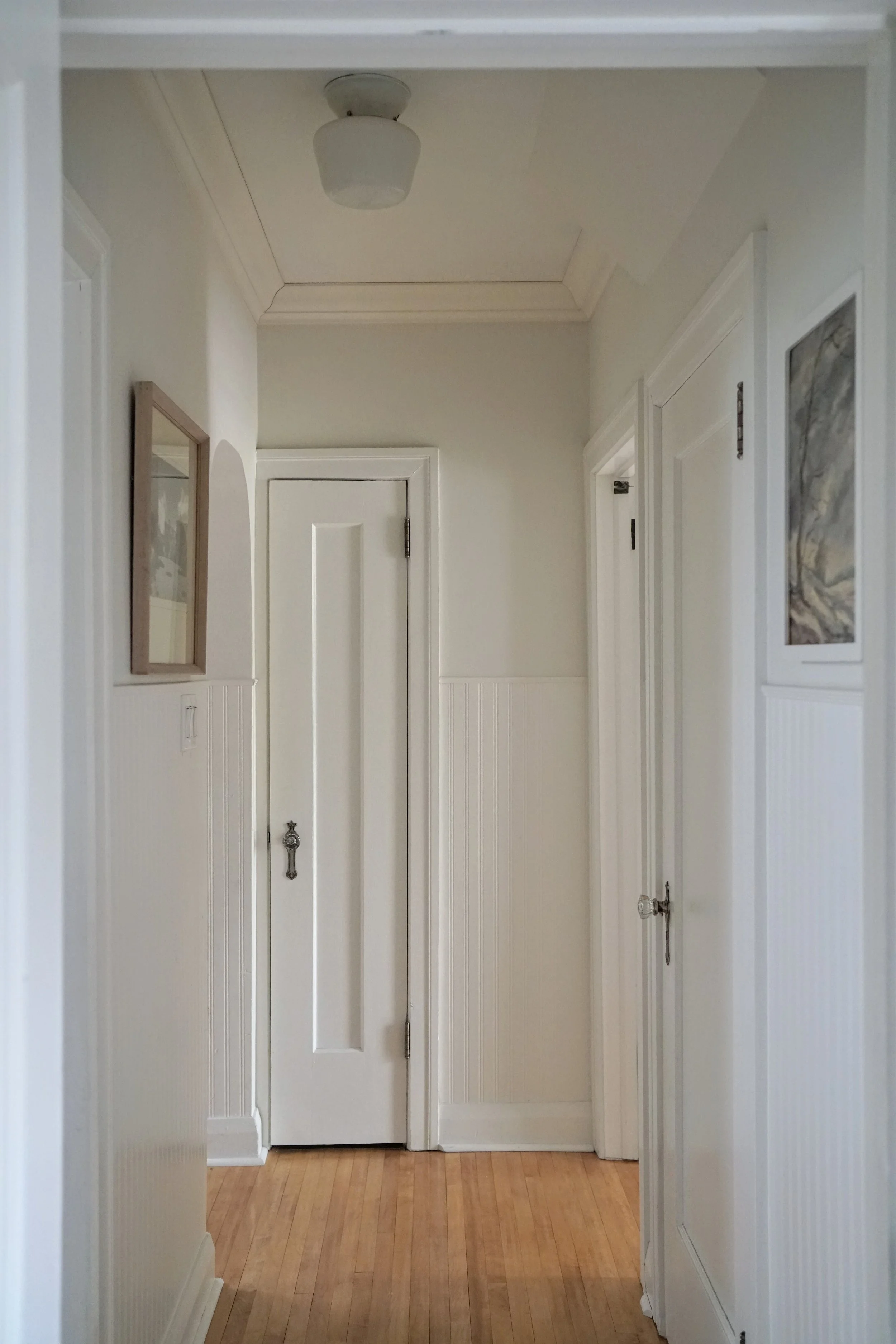 Small hallway with beadboard wainscotting - Cheryl Lee Interiors