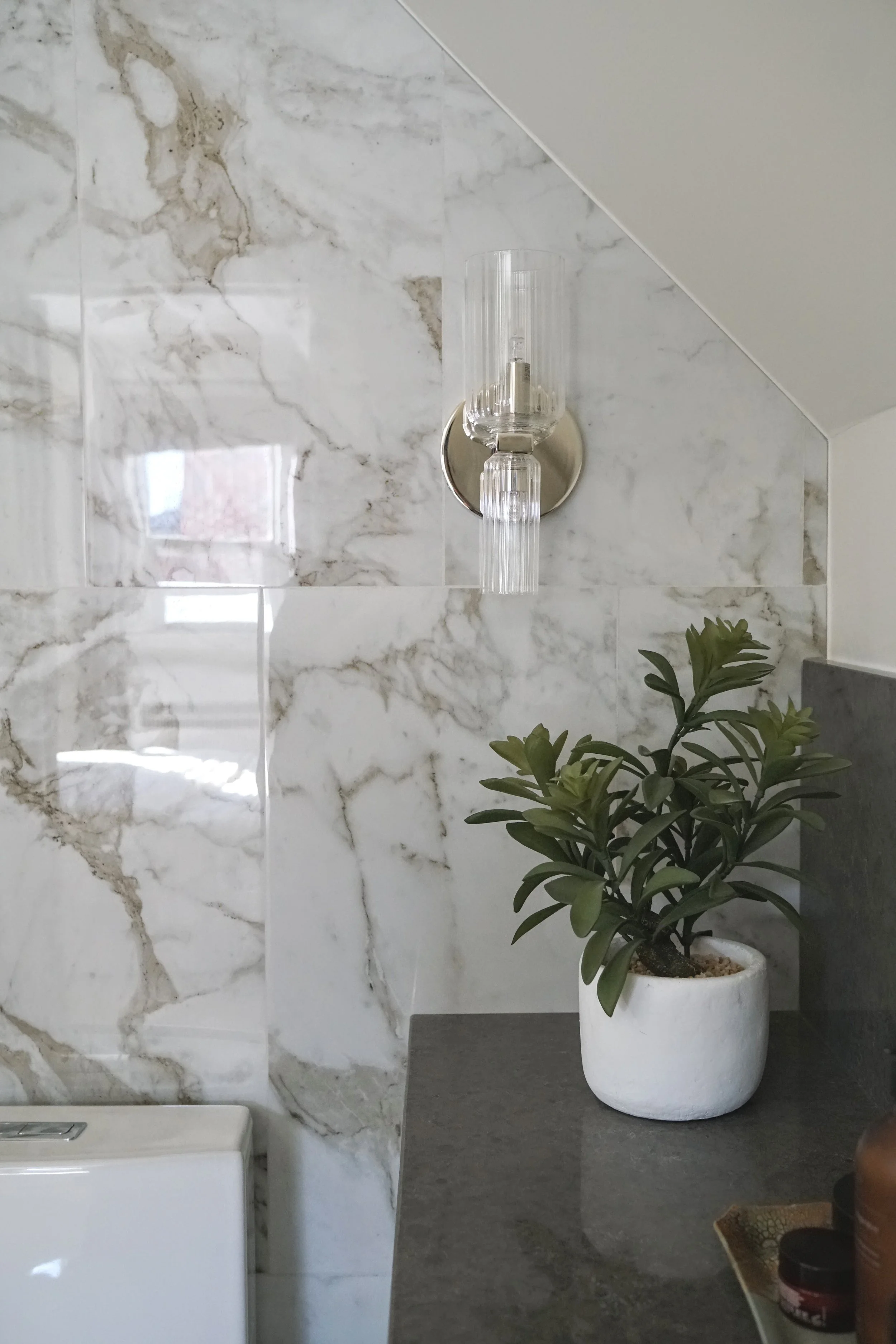 Small space sloped ceiling washroom - Cheryl Lee Interiors