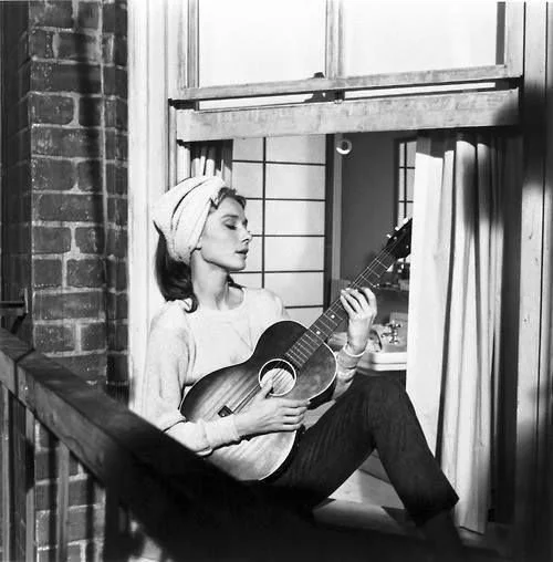 Audrey Hepburn singing Moon River in Breakfast At Tiffany's.jpeg