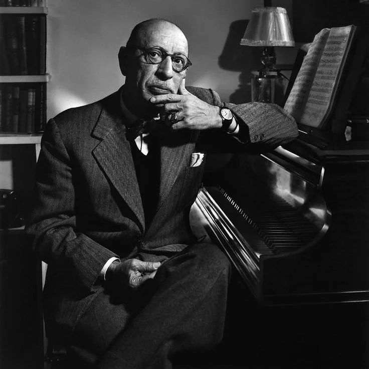 Vintage black and white photograph of composer Igor Stravinsky at the piano.