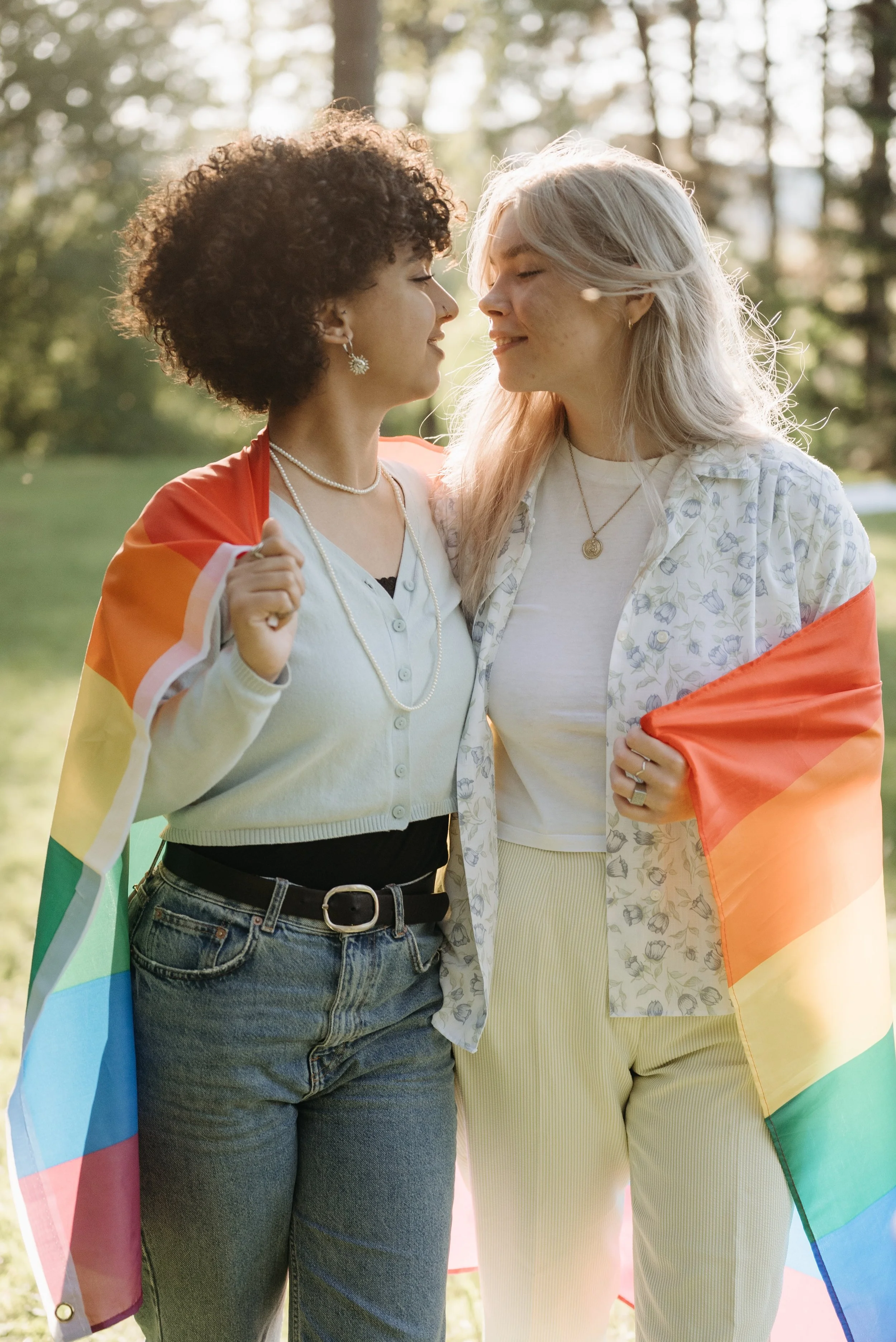 Lesbian couple wearing pride flag in Austin