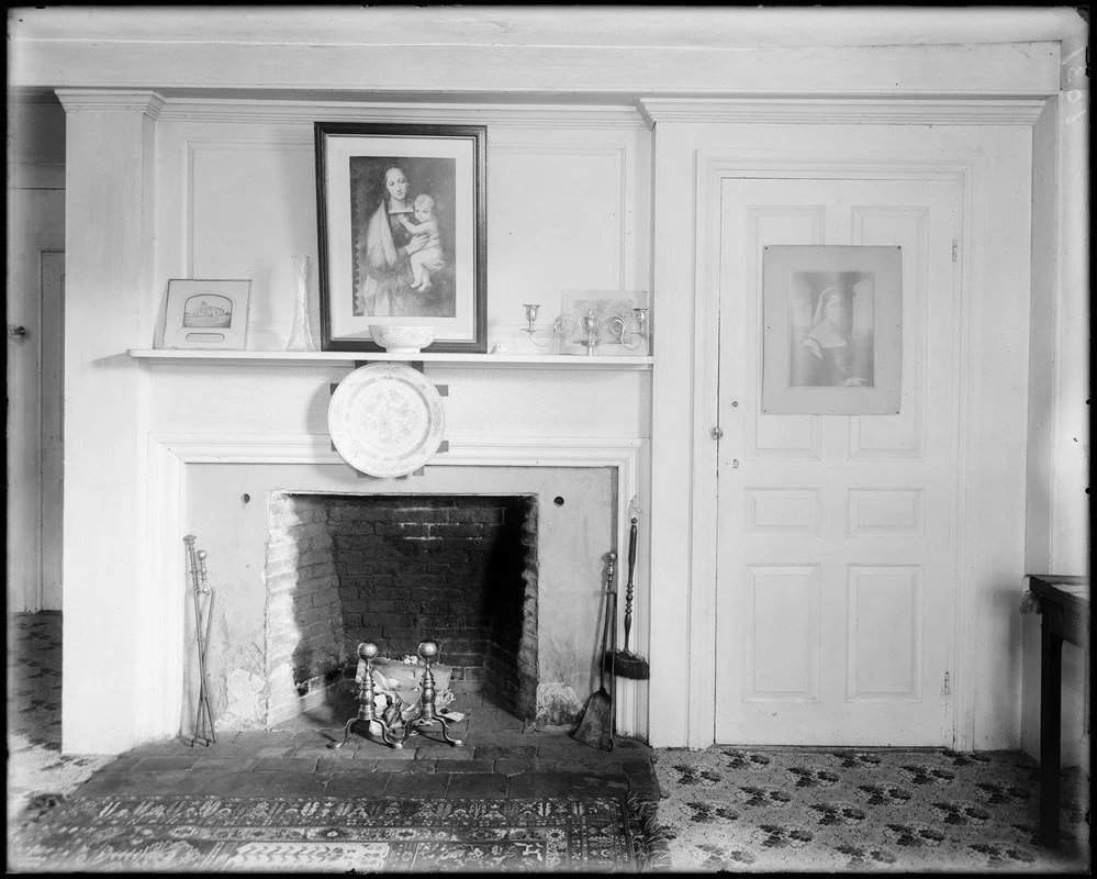 Black and white picture of an old parlor room in historic house.