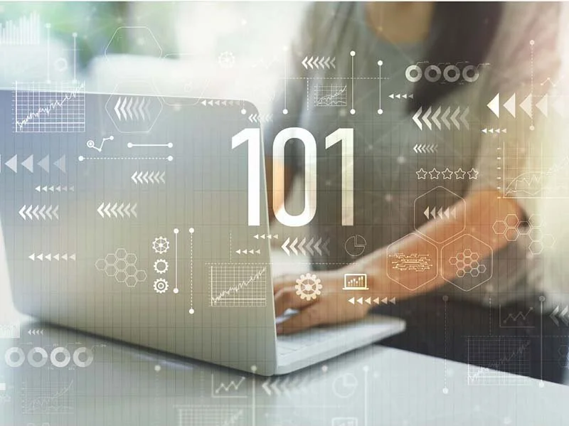 Person working on a laptop with digital analytics dashboard overlay showing charts, arrows, and the number 101