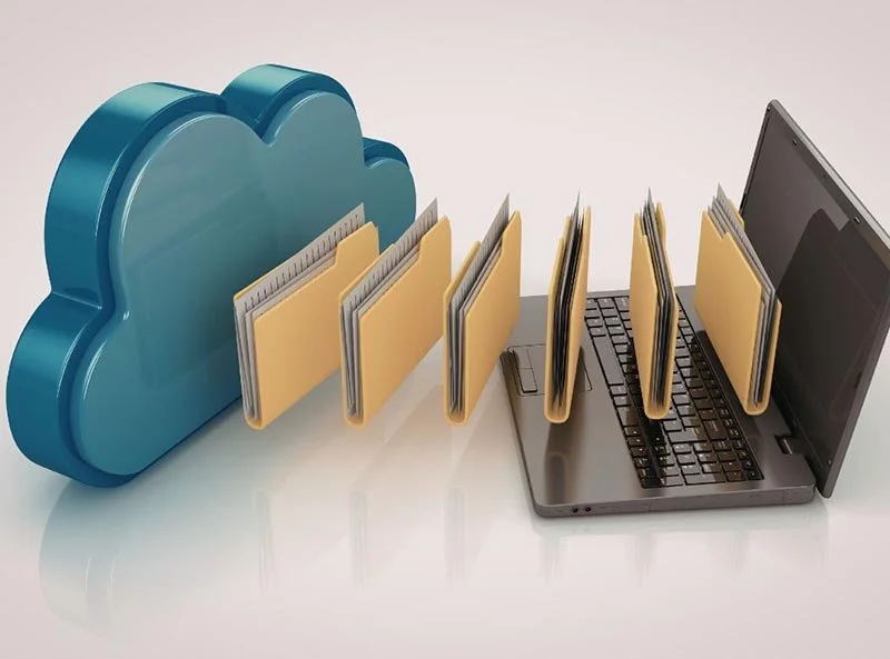 Laptop transferring digital file folders to and from a cloud storage icon.