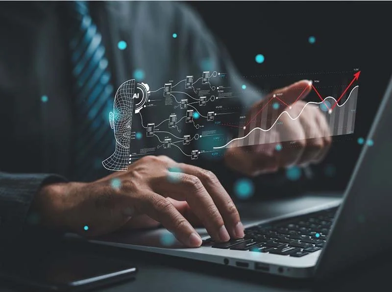 Person using a laptop with AI-powered data analytics interface displaying machine learning workflow, performance metrics, and business growth charts.