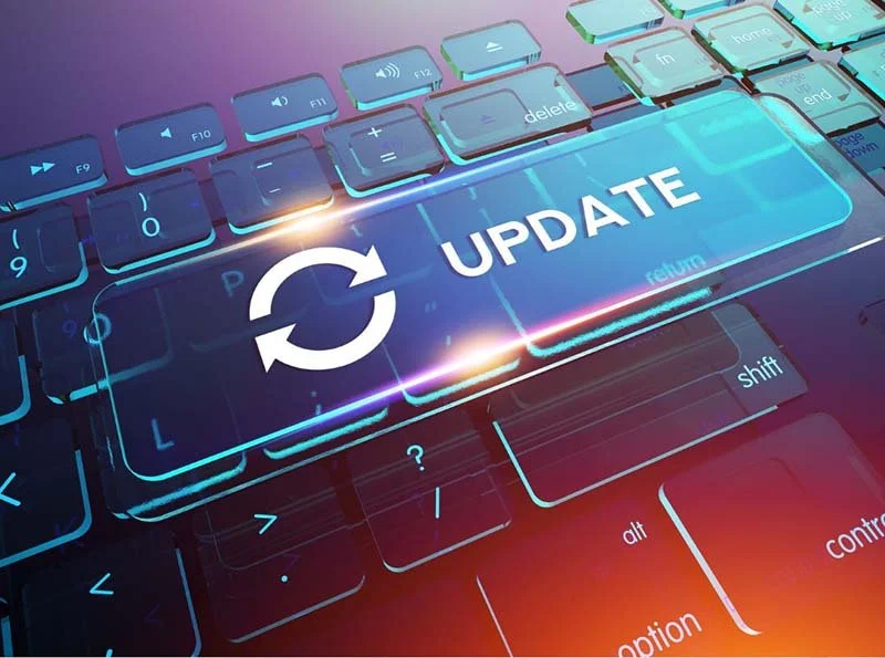 Computer keyboard with highlighted update button and circular refresh icon