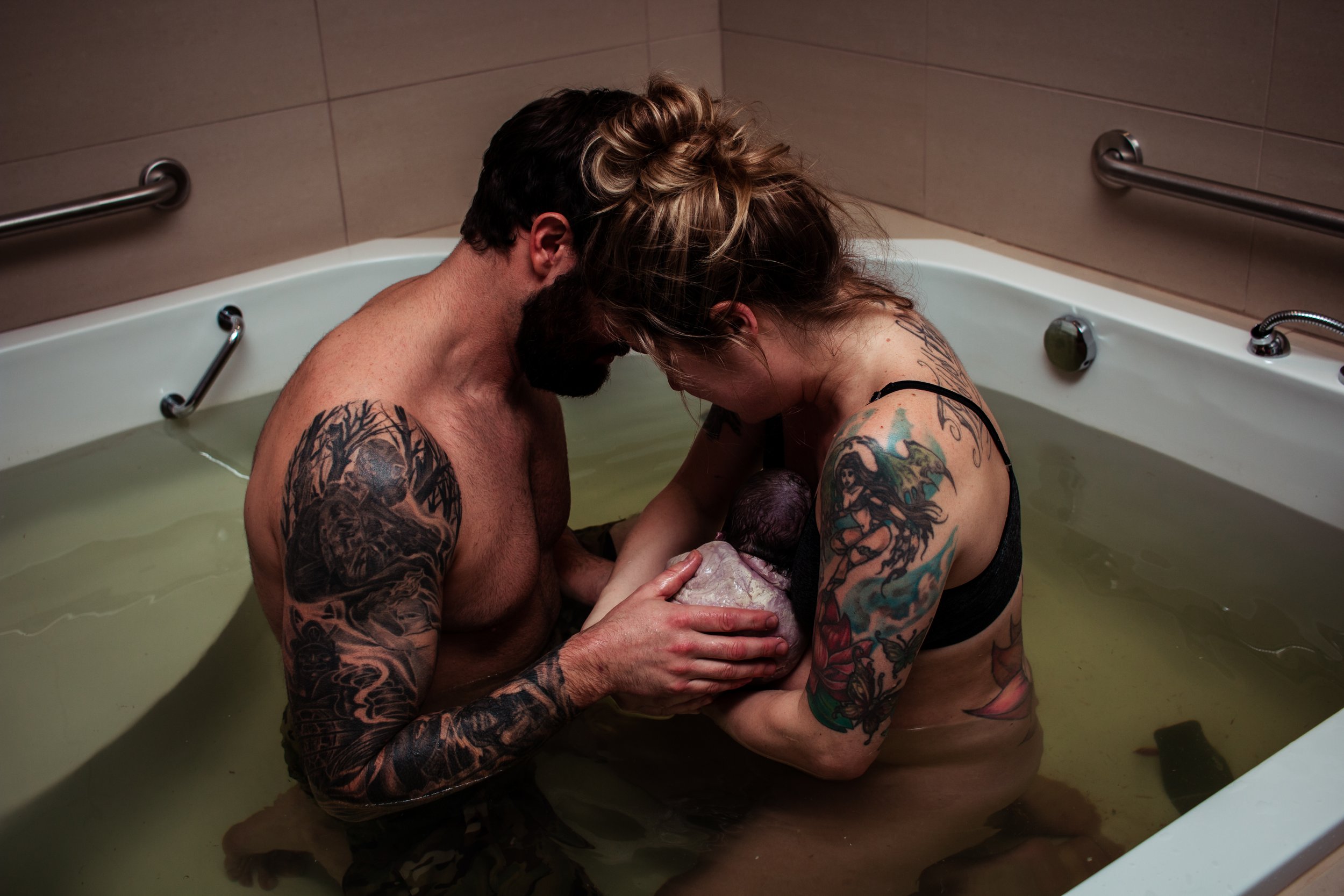 Mom holding newborns after cesarean birth
