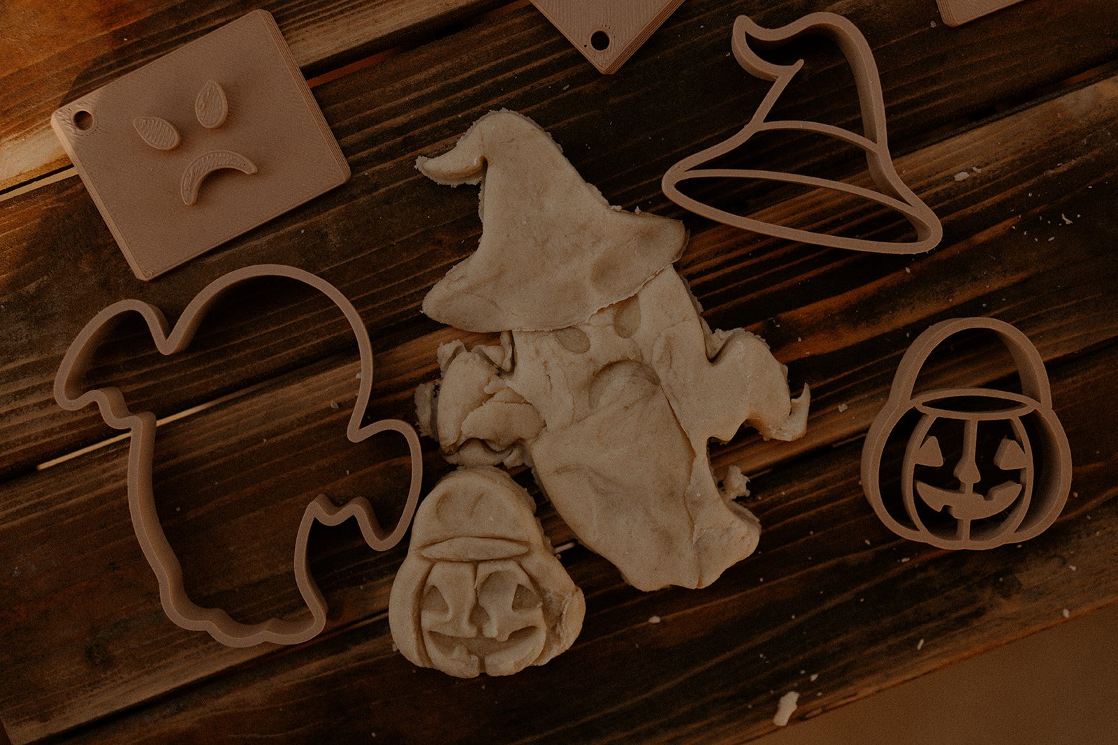 Eco-friendly Halloween playdough stamps and cutters with pressed shapes on soft dough